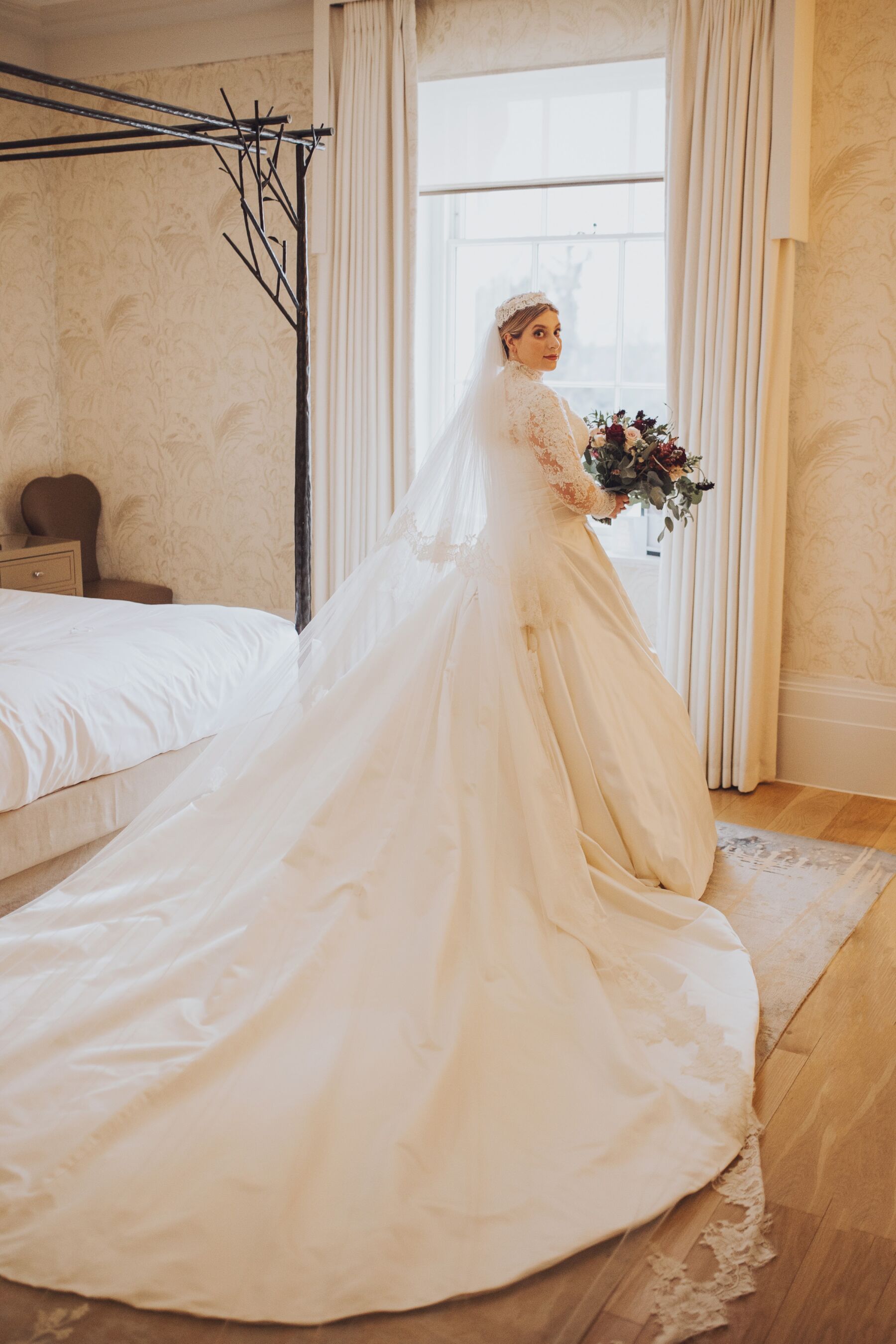 Fuller figure curvy bride wearing a long sleeved wedding dress by Sally Bean Couture