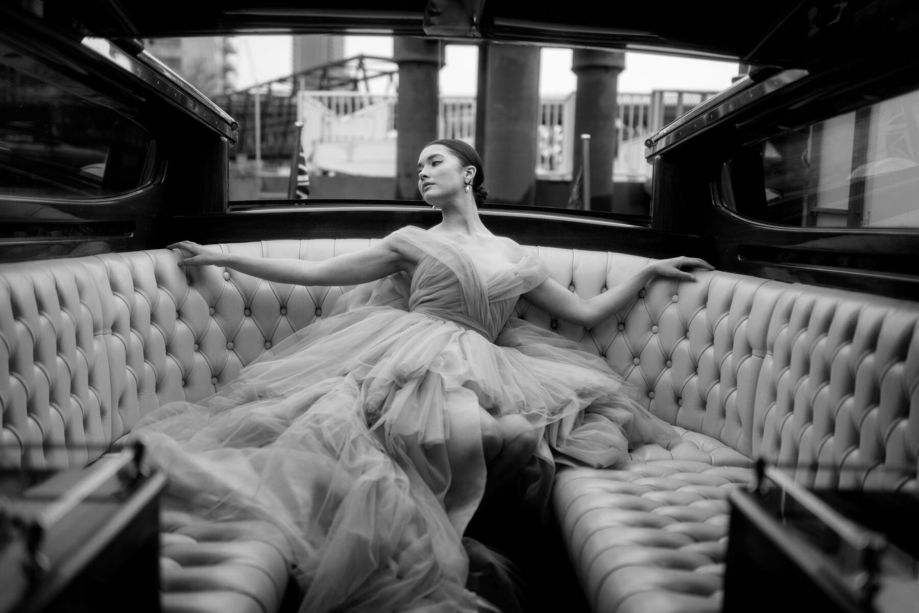 Bride sat on a speedboat in a Sally Bean Couture luxury tulle wedding dress