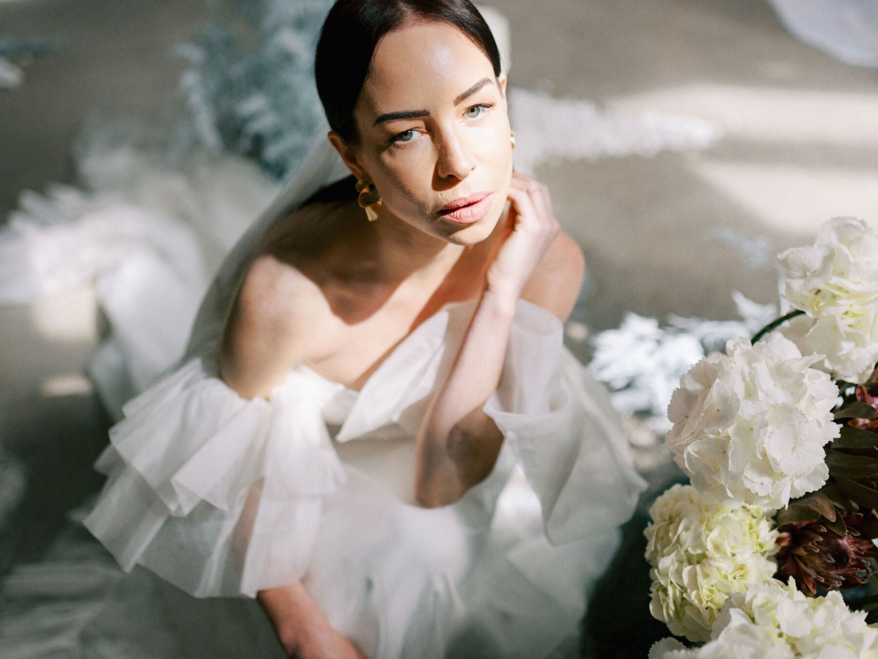 Modern bride in Halfpenny London with pale pink lipstick.