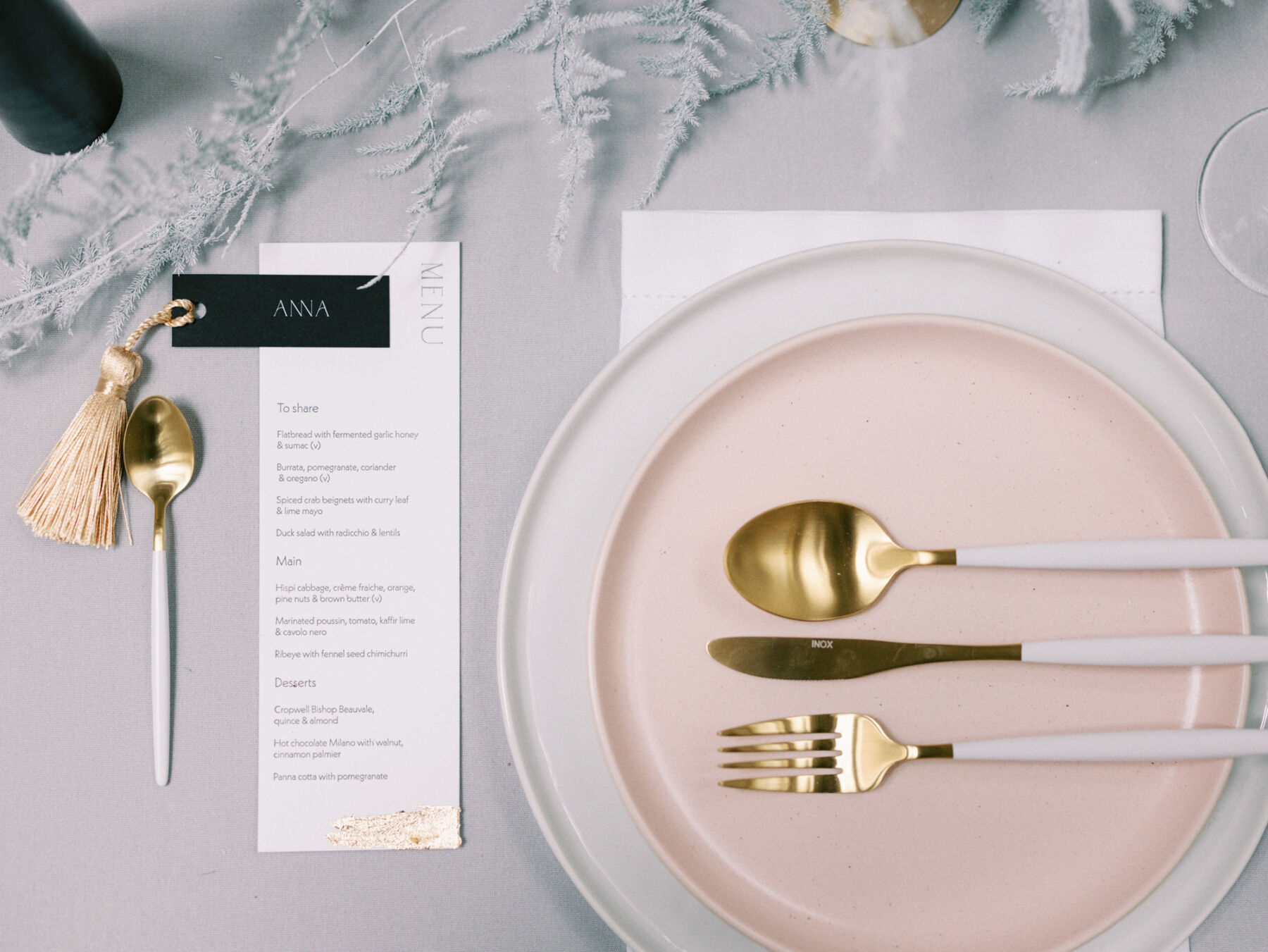 Modern wedding table decor with gold cutlery