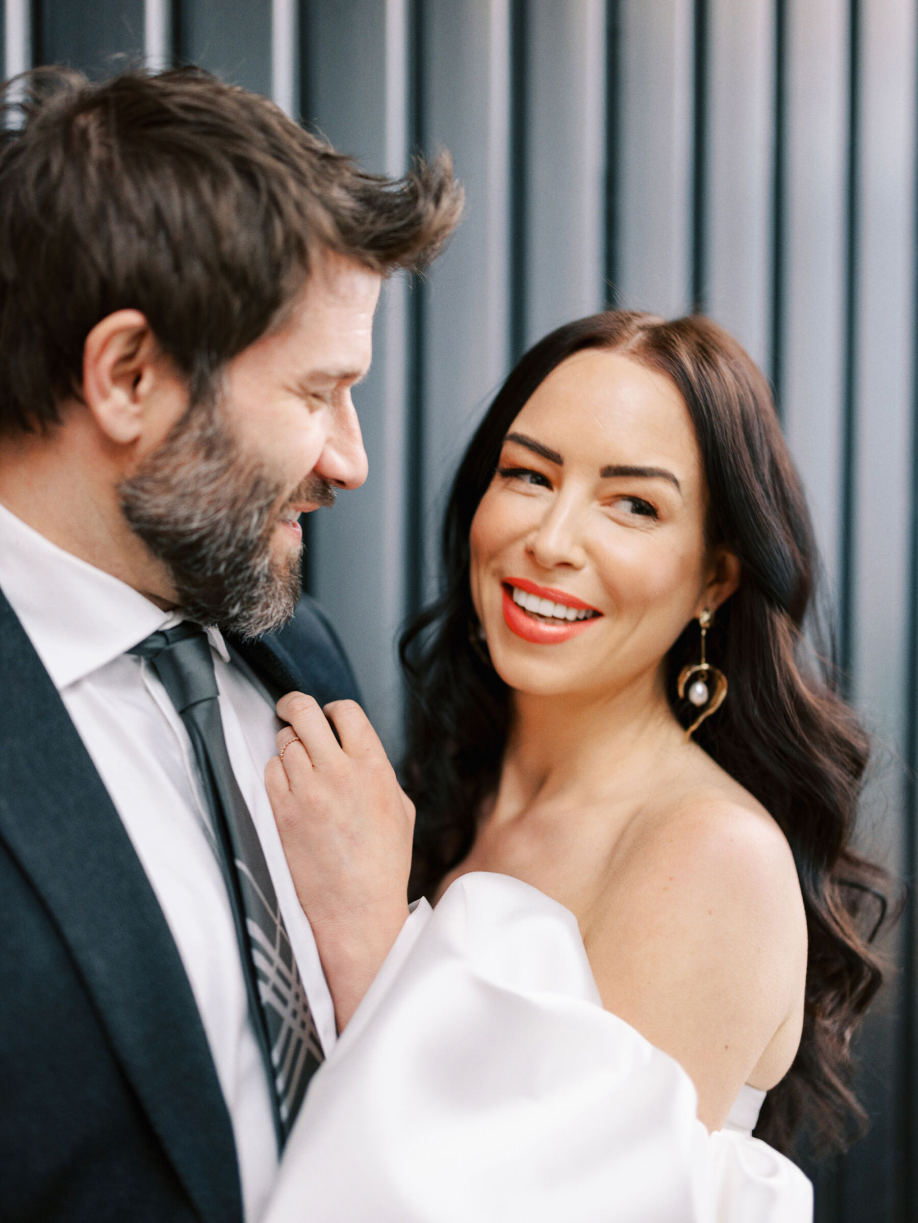 Bride in Halfpenny London dress with detachable puff sleeves.