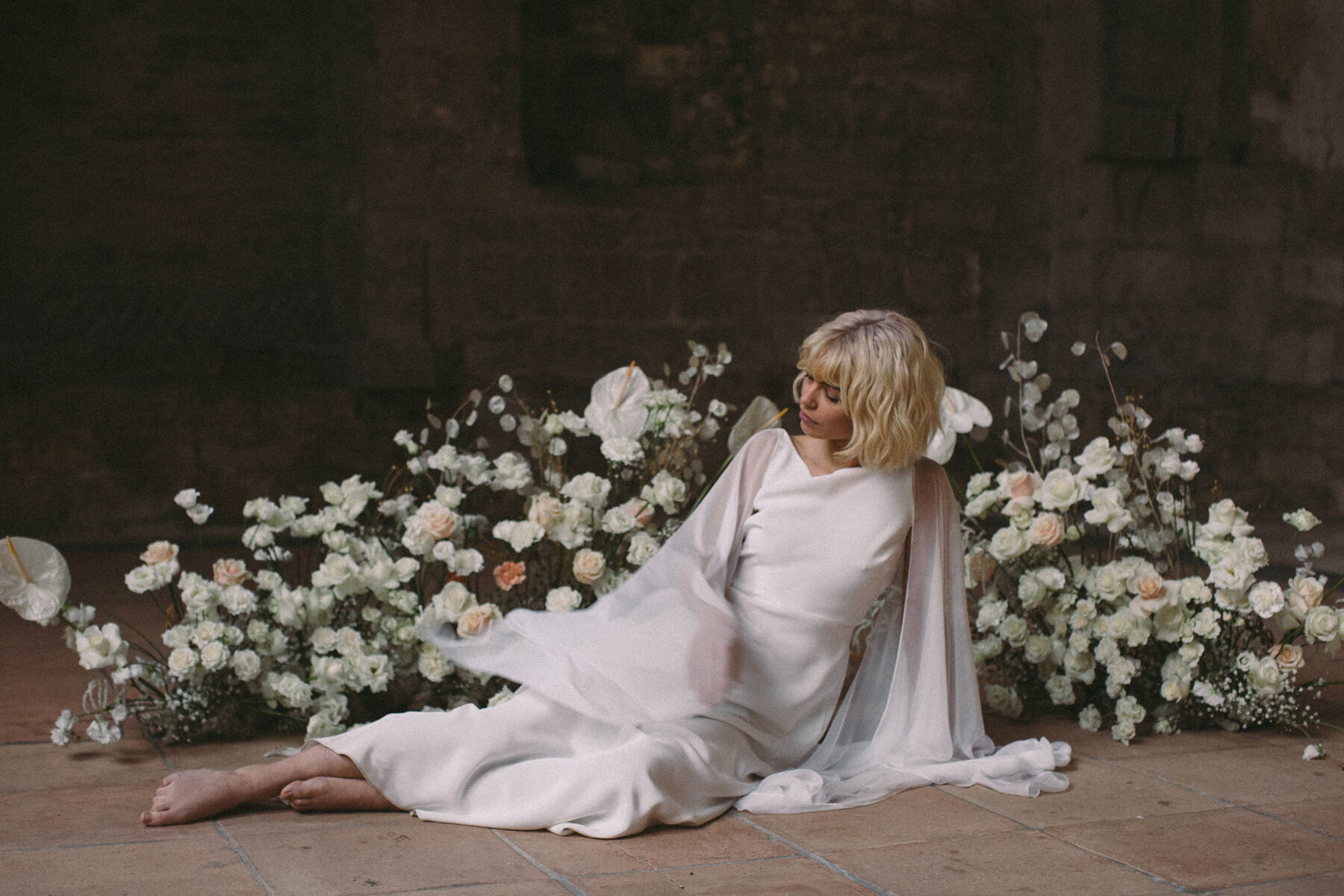 Bride wearing a modern bohemian wedding dress by Wilden London. Image by Jess Withey.