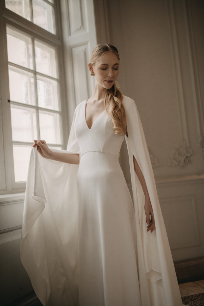 Andrea Hawkes, simple, sustainable wedding dress with cape.
