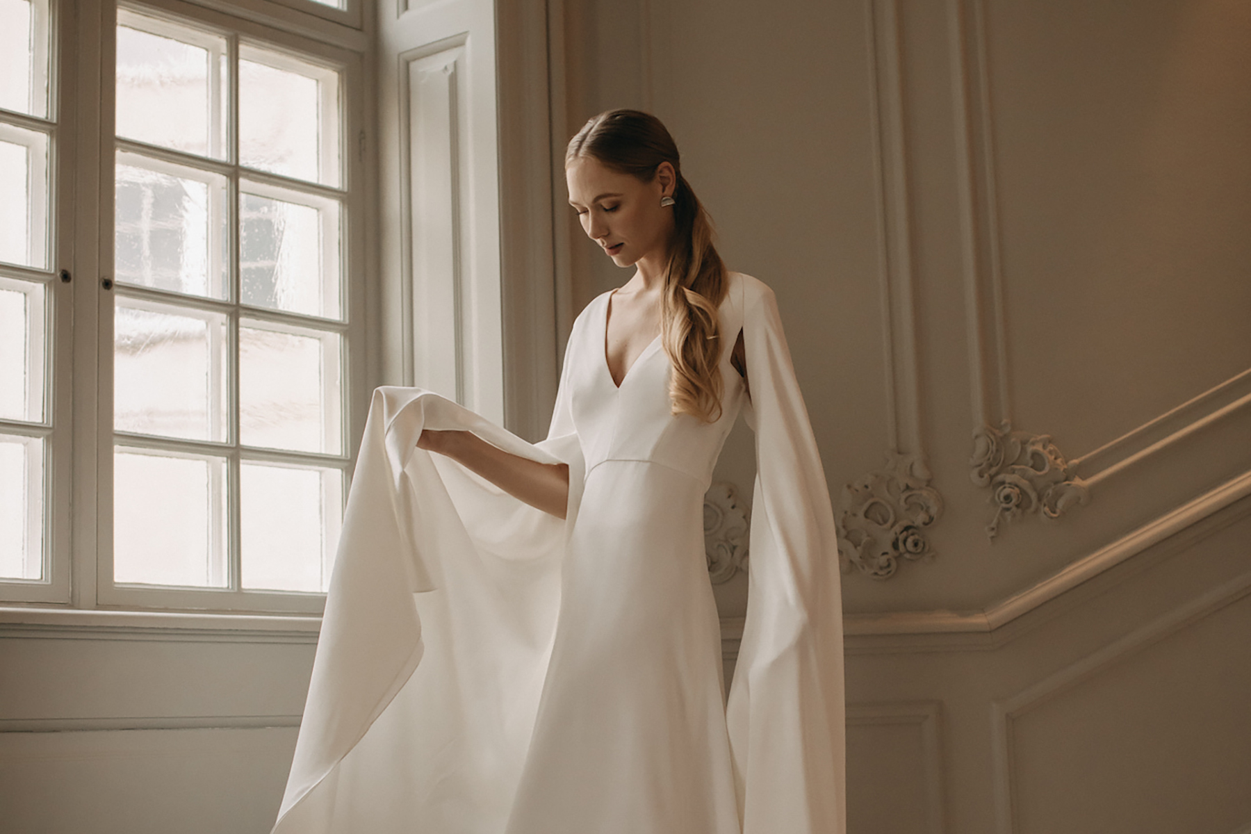 Andrea Hawkes, simple, sustainable wedding dress with cape.