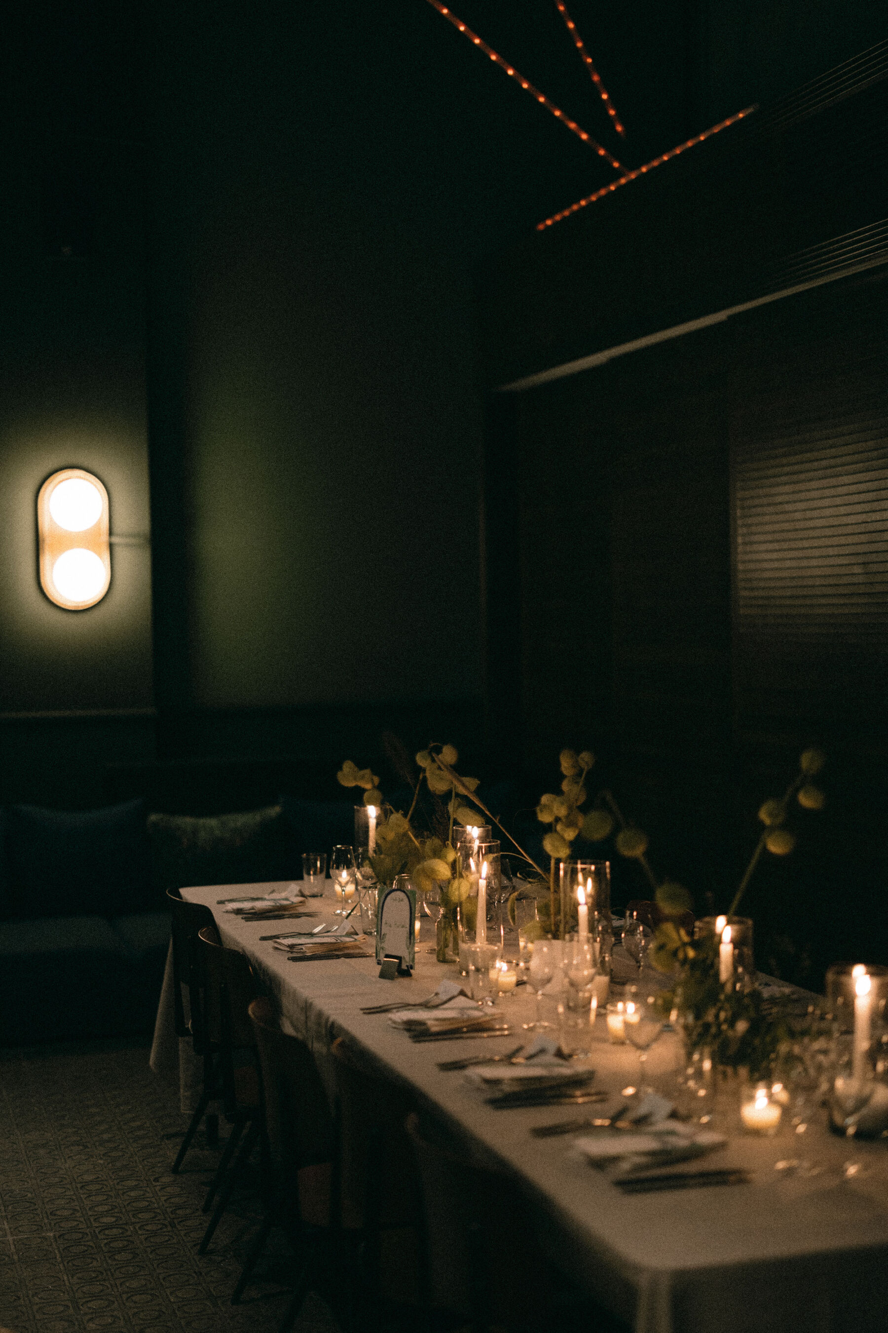 Romantic candle lit wedding reception setting. Rebecca Rees Photography.