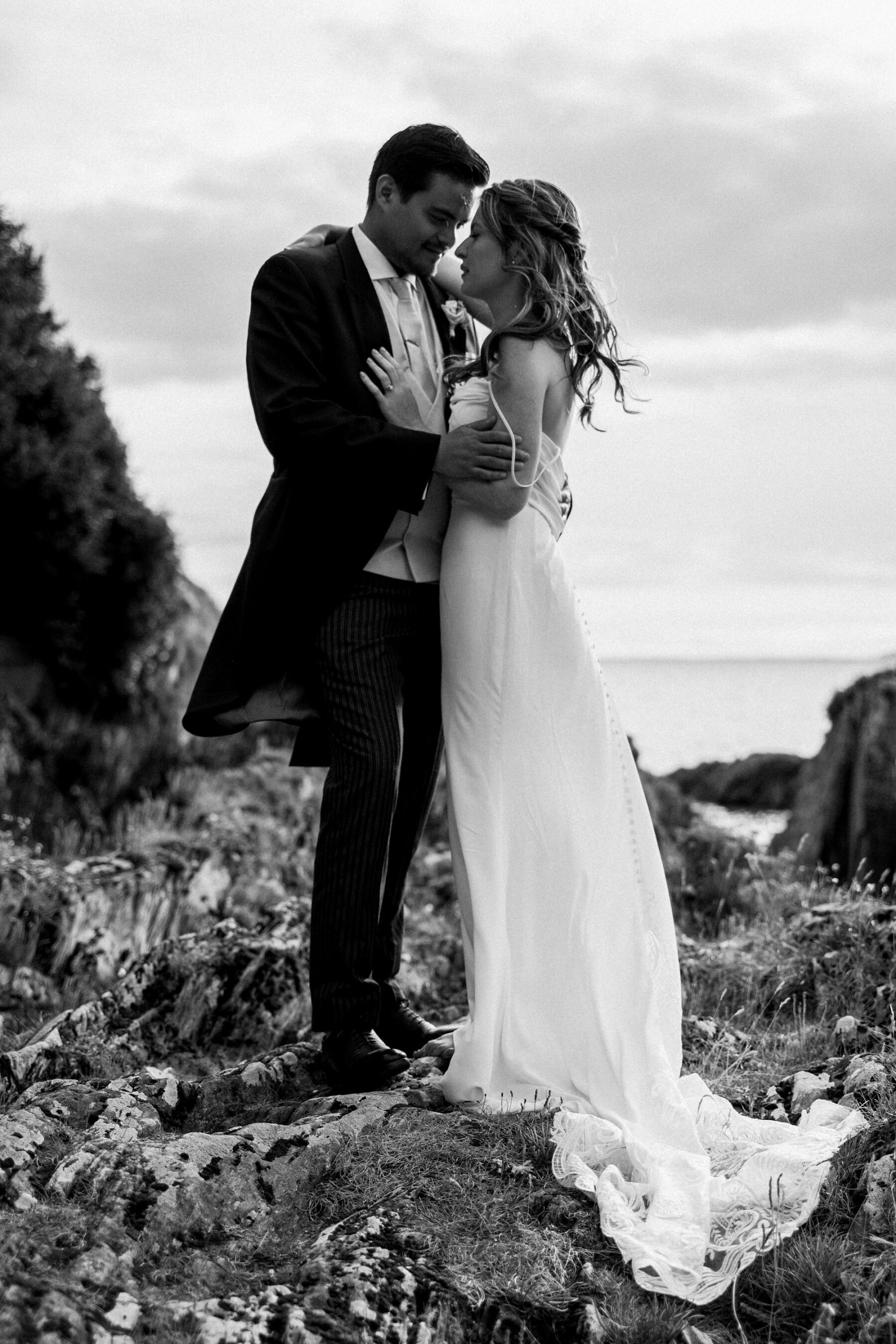 Black and white shot of bride and groom in loving embrace
