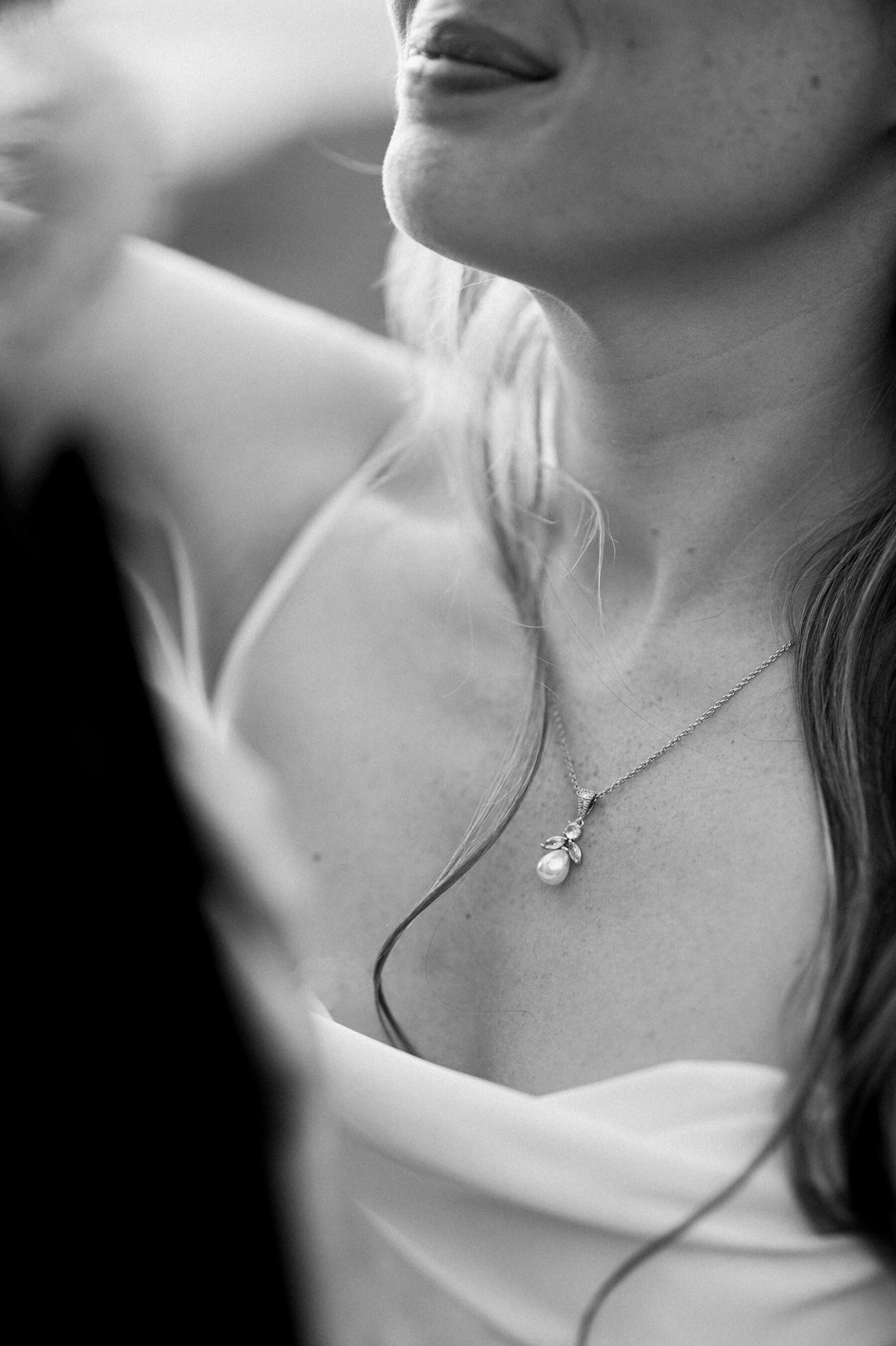 Close up of bride's pearl necklace