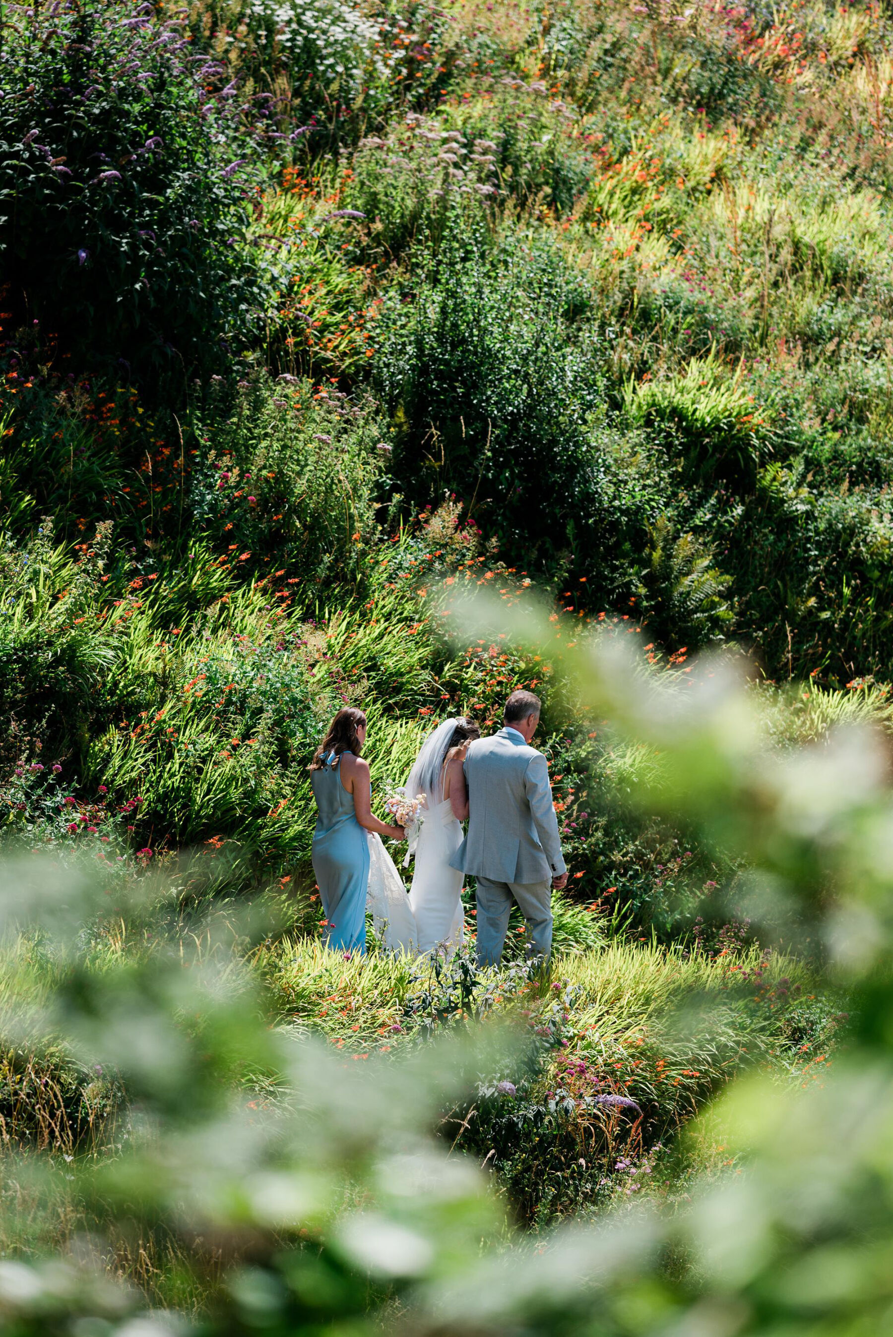 Bride surrounded by bushes at Polhawn Fort in Cornwall