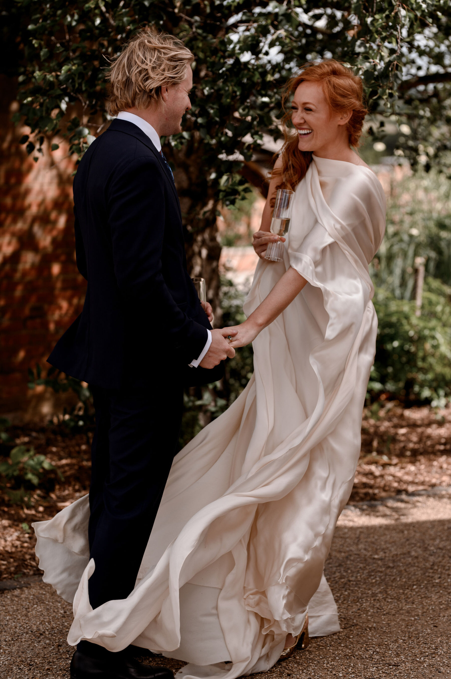 Bride with red hair wearing a Cortana wedding dress. Taylor Hughes Photography.