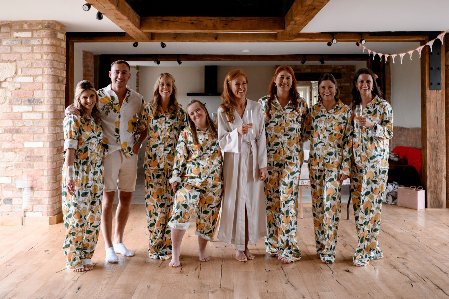 Bridesmaids in lemon pyjamas getting read with bride. Taylor Hughes Photography.