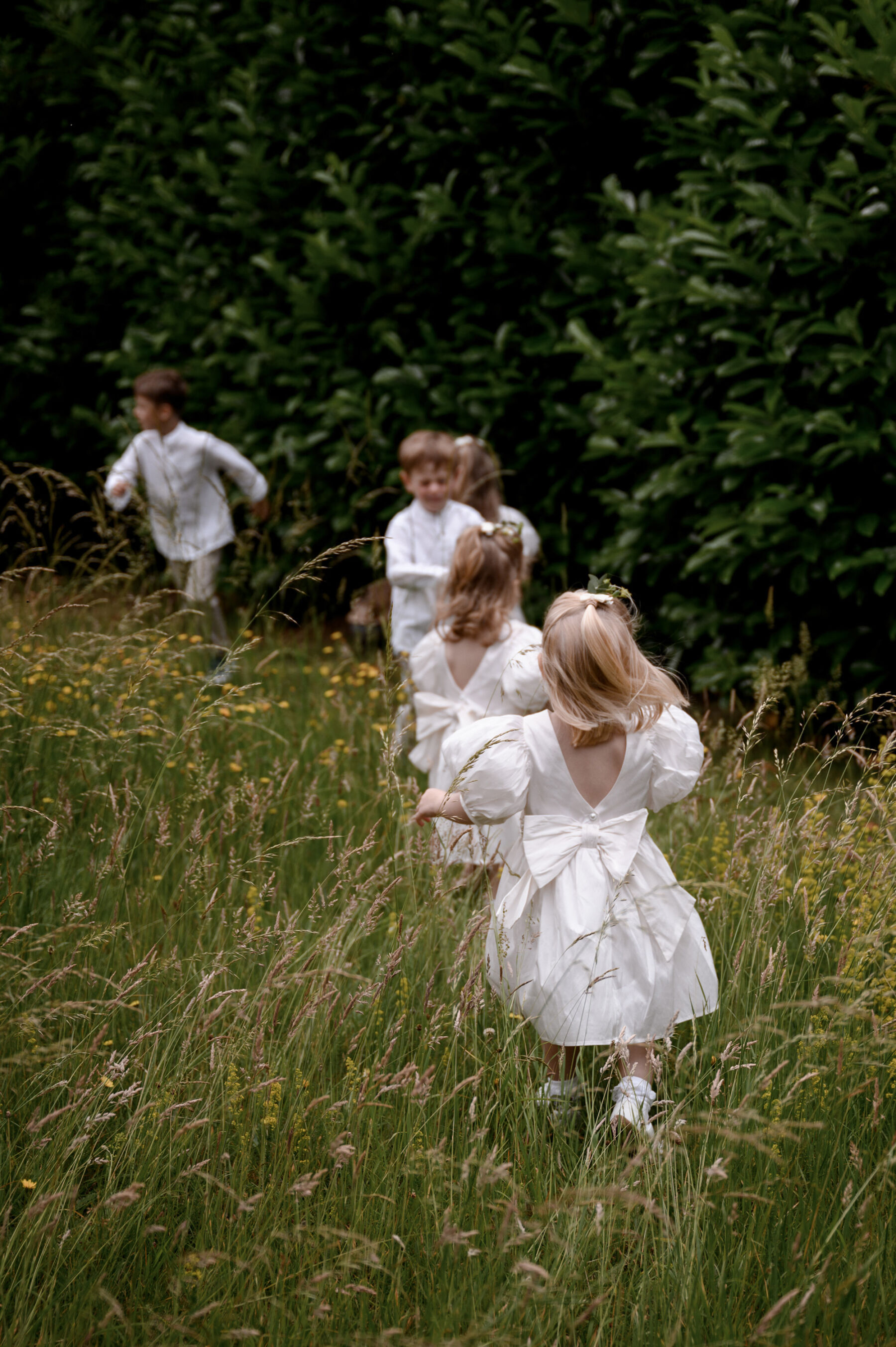 Little flower girls in dresses from Next. Taylor Hughes Photography.