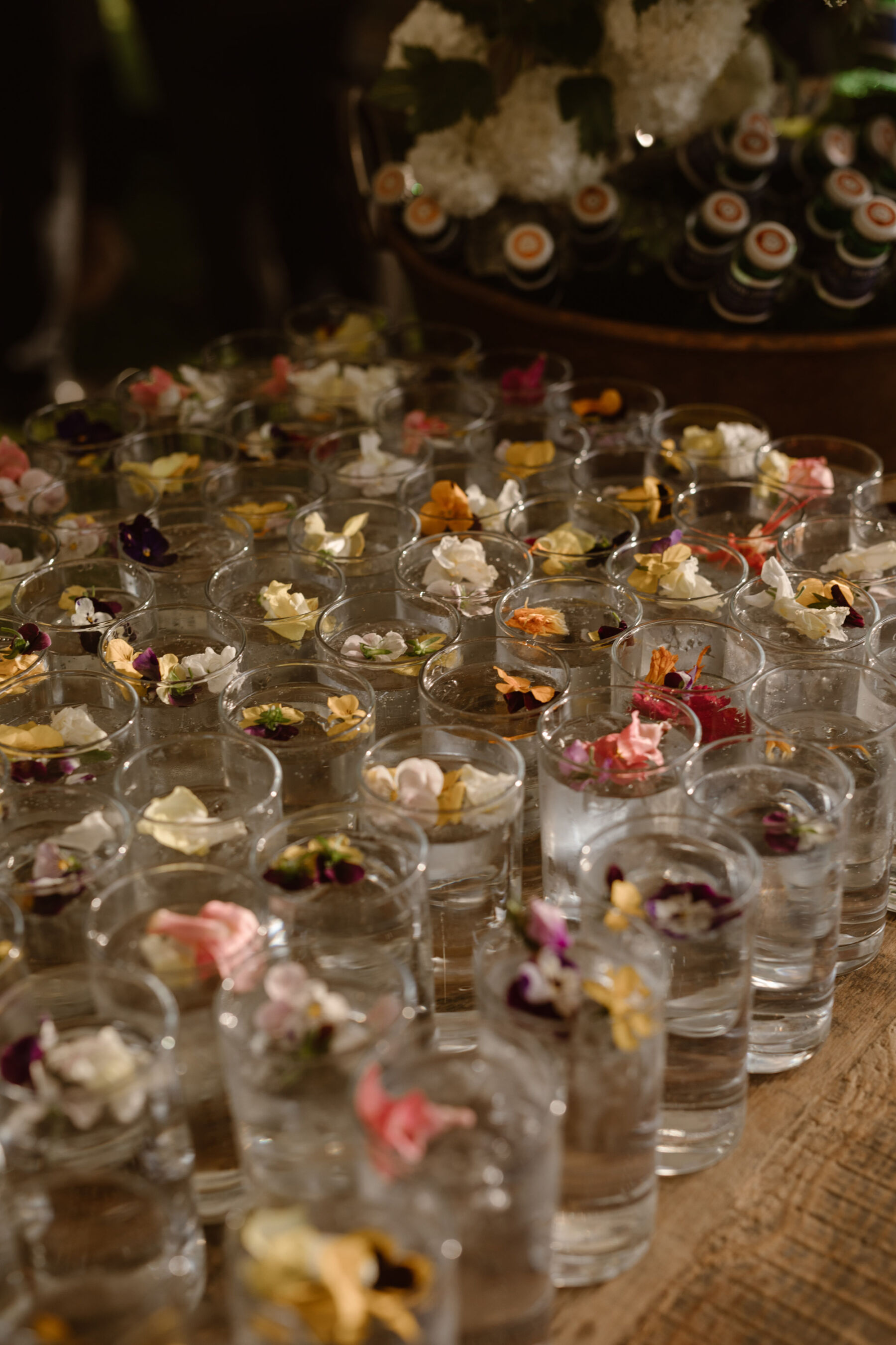 A Look Inside Dewsall Court Country House, A Family Run Wedding Venue in Herefordshire 28 Glasses of water with edible flowers. Agnes Black Photography.