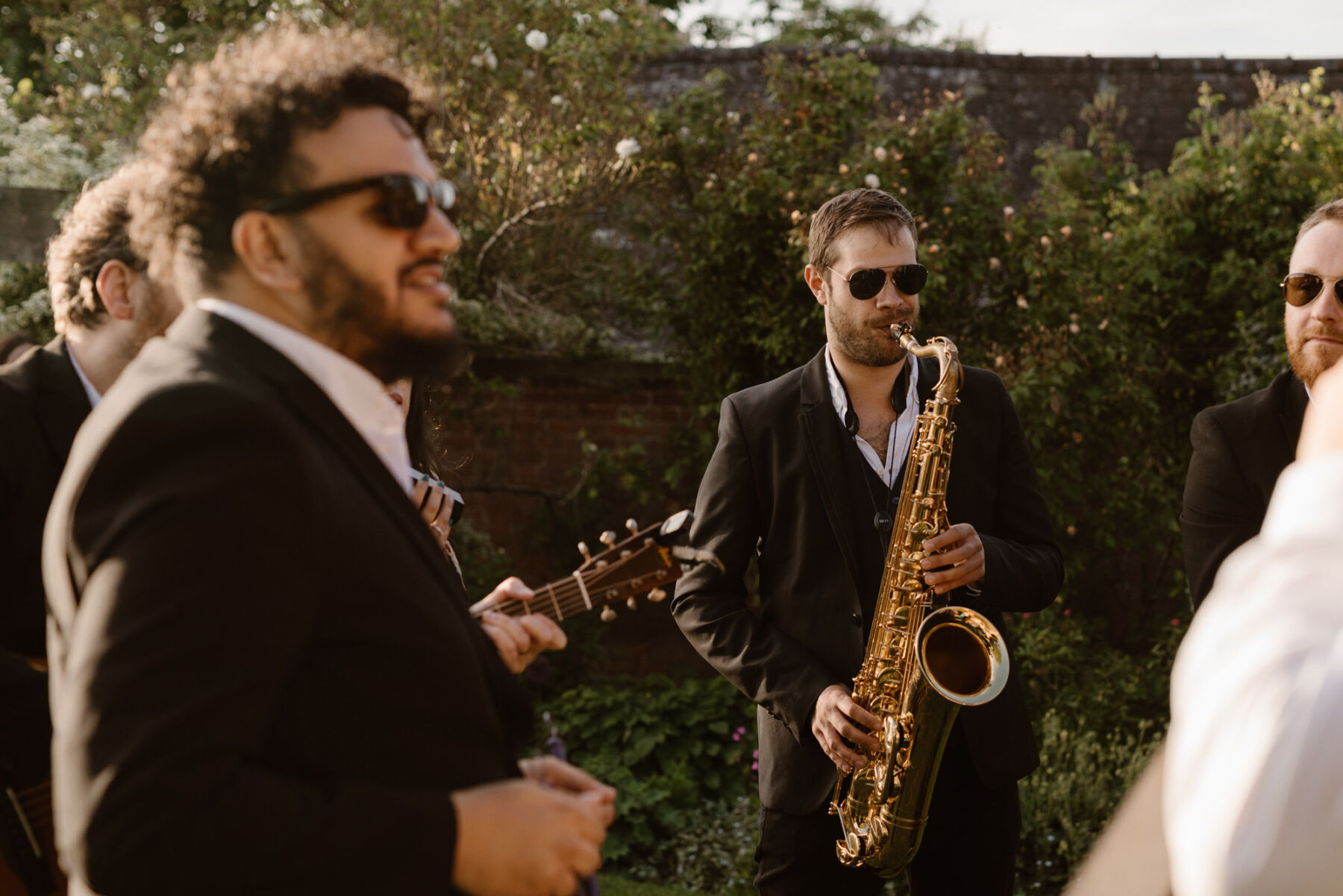 Live 4 piece jazz band performing to wedding guests at Dewsall Court. Agnes Black Photography.