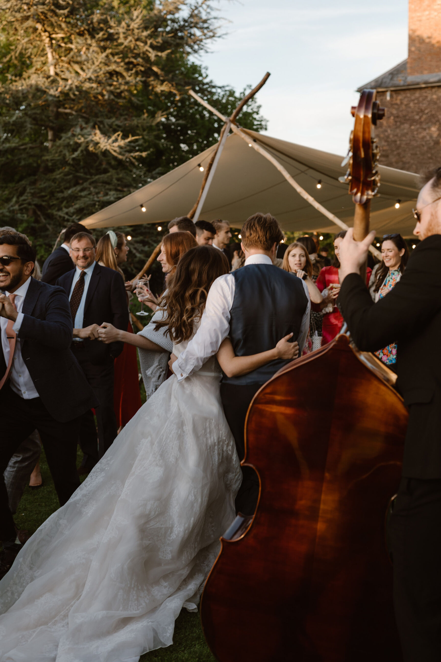 Bride and groom and live jazz band at Dewsall Court. Agnes Black Photography.