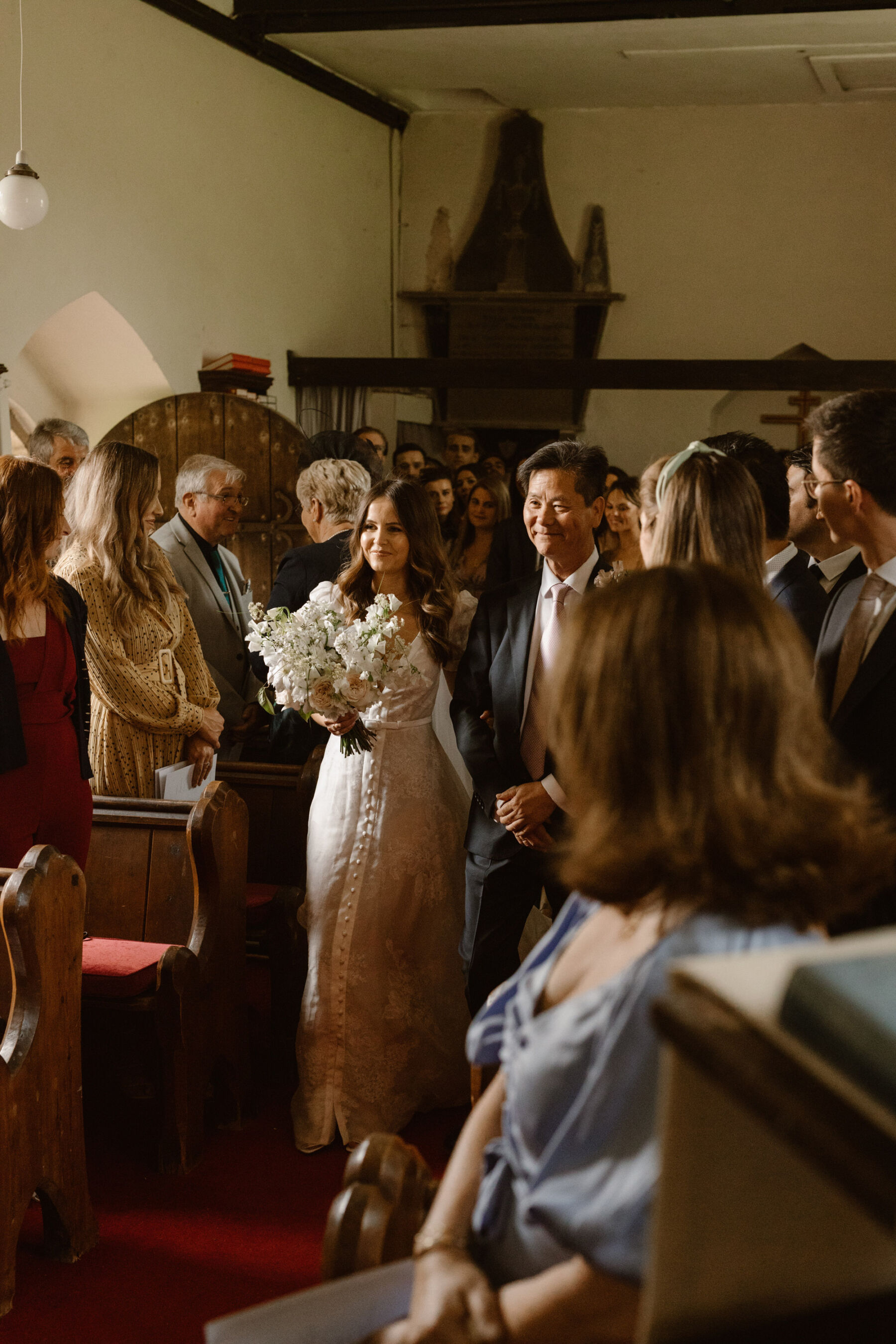 Jess in J. Andreatta for her Elegant Weekend Wedding at Dewsall Court 16 Wedding at Dewsall church, Herefordshire. Agnes Black Photography.
