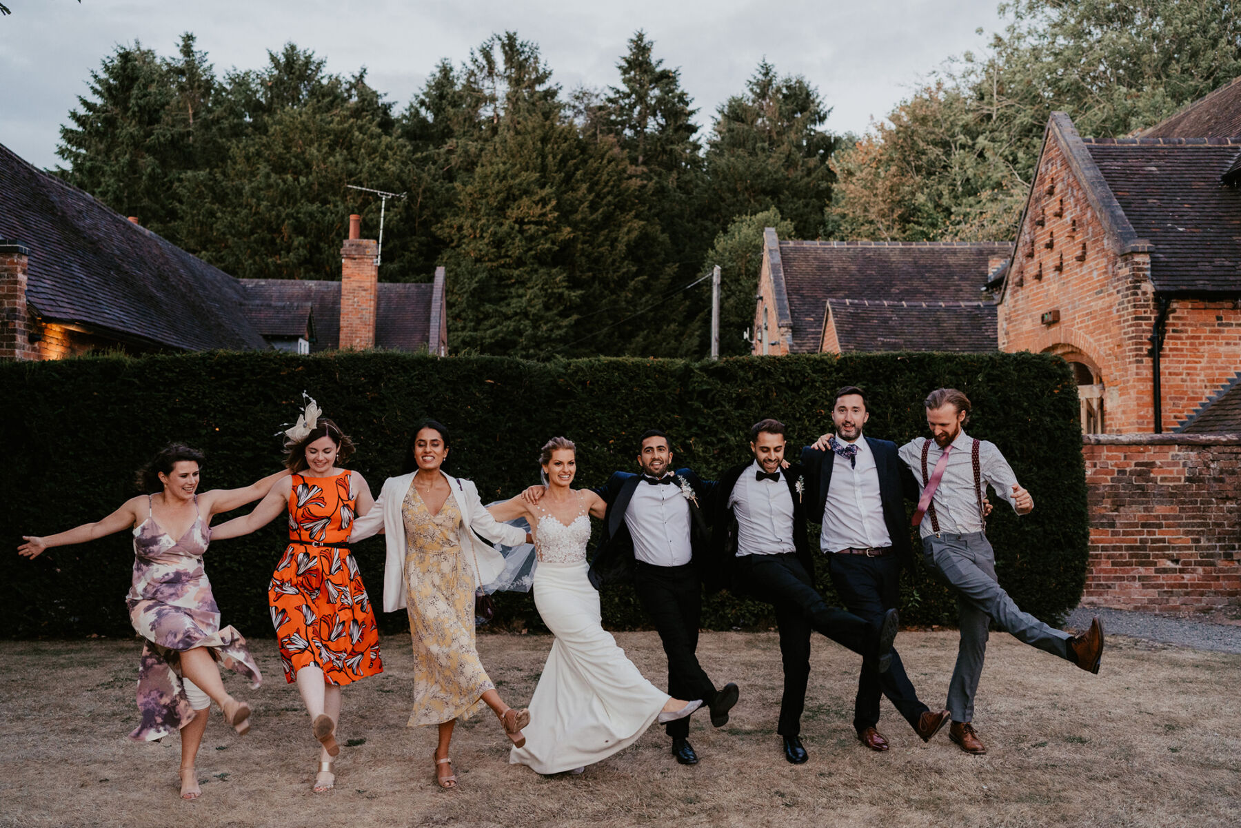 Bride and groom in a dance lineup at Shustoke barn. 