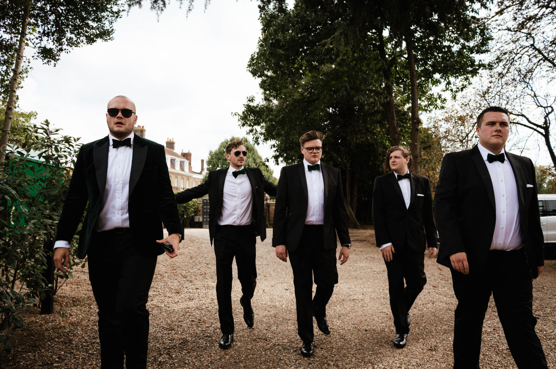 Groom and groomsmen in black tie at Hampton Court House Birmingham. Robin Goodlad Photography
