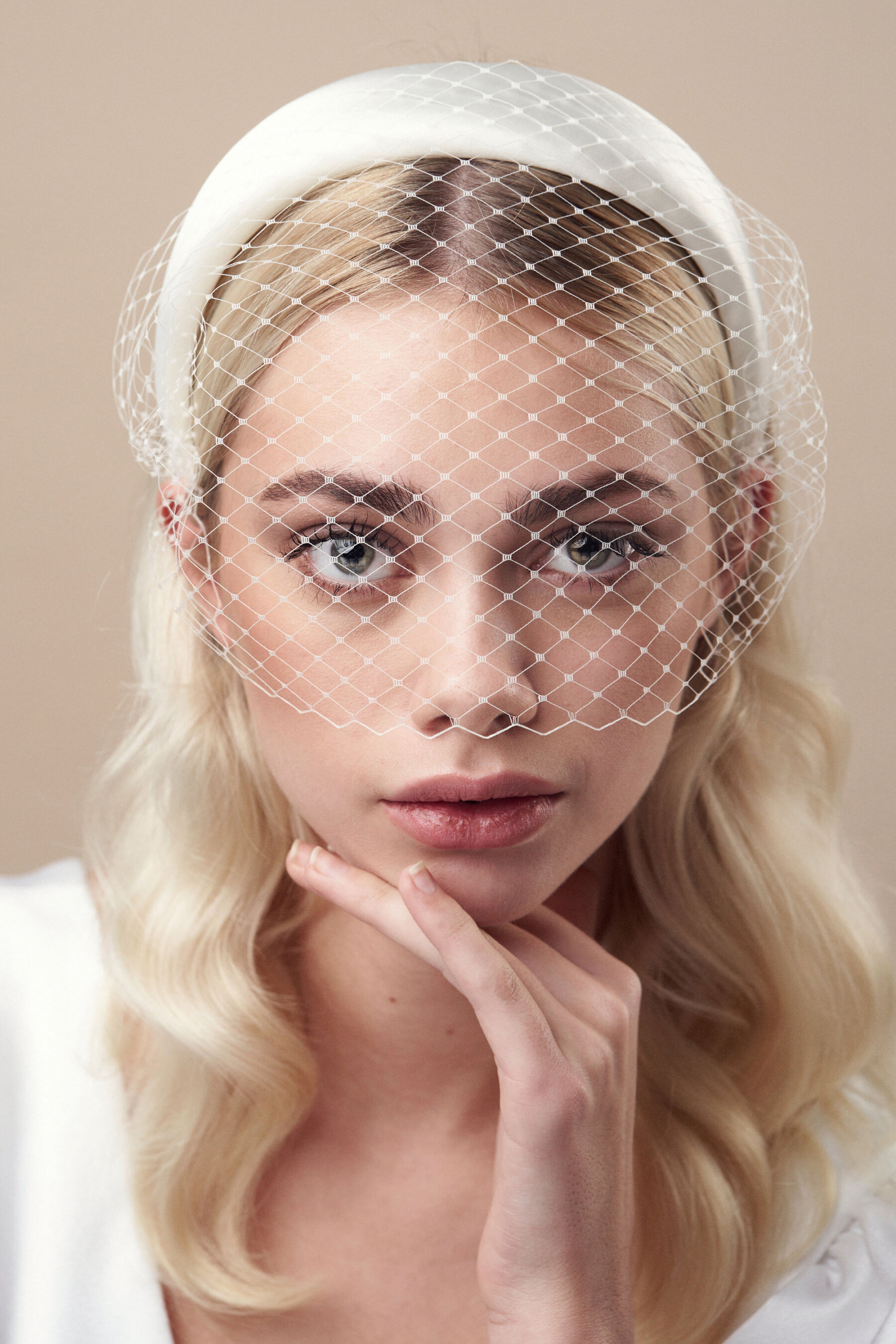 Ivory padded wedding headband with attached birdcage veil by Debbie Carlisle