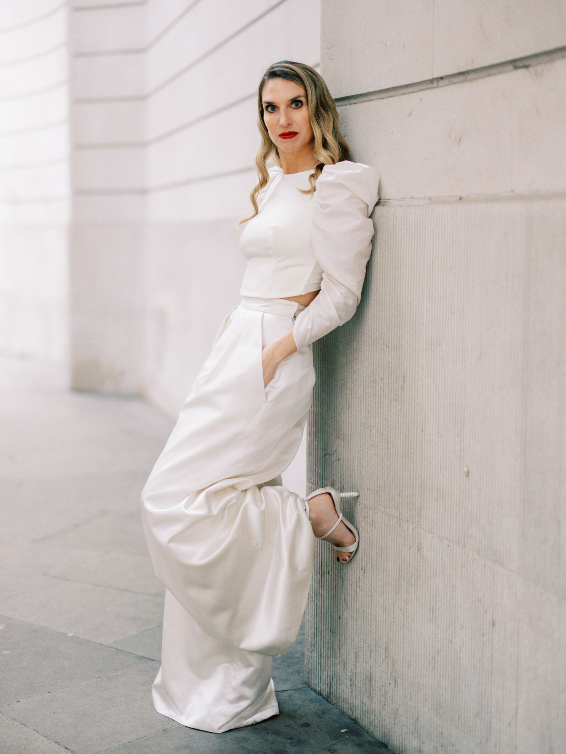 Halfpenny London Glamour at The Ned Hotel, Inspired by Peter Lindbergh and Dior 20 Modern bride in red lipstick and wide legged trousers by Halfpenny London. Kernwell Photography.