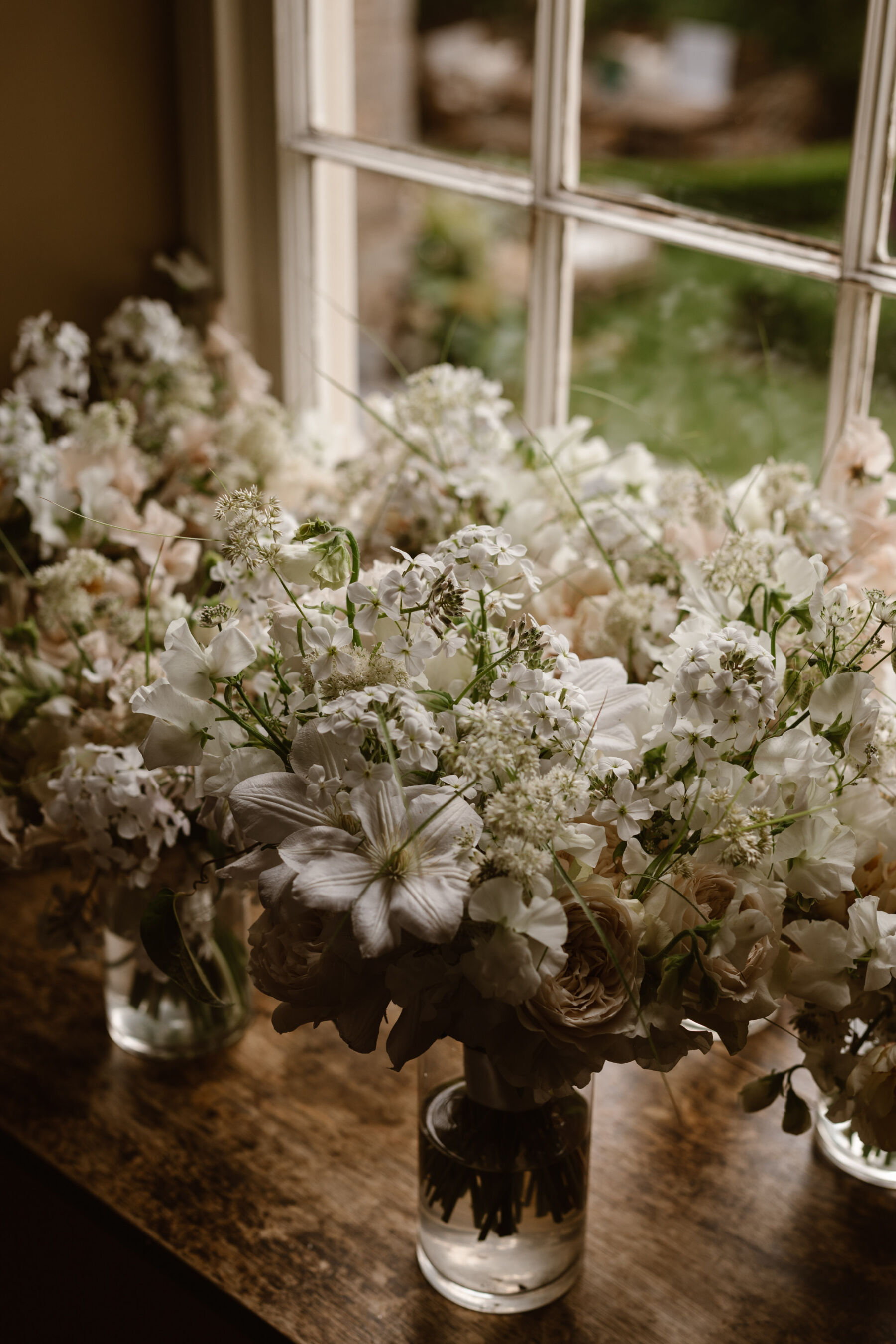 Delicate white and pale pink wedding bouquets by Liberty Lane Flowers. J Agnes Black Photography.