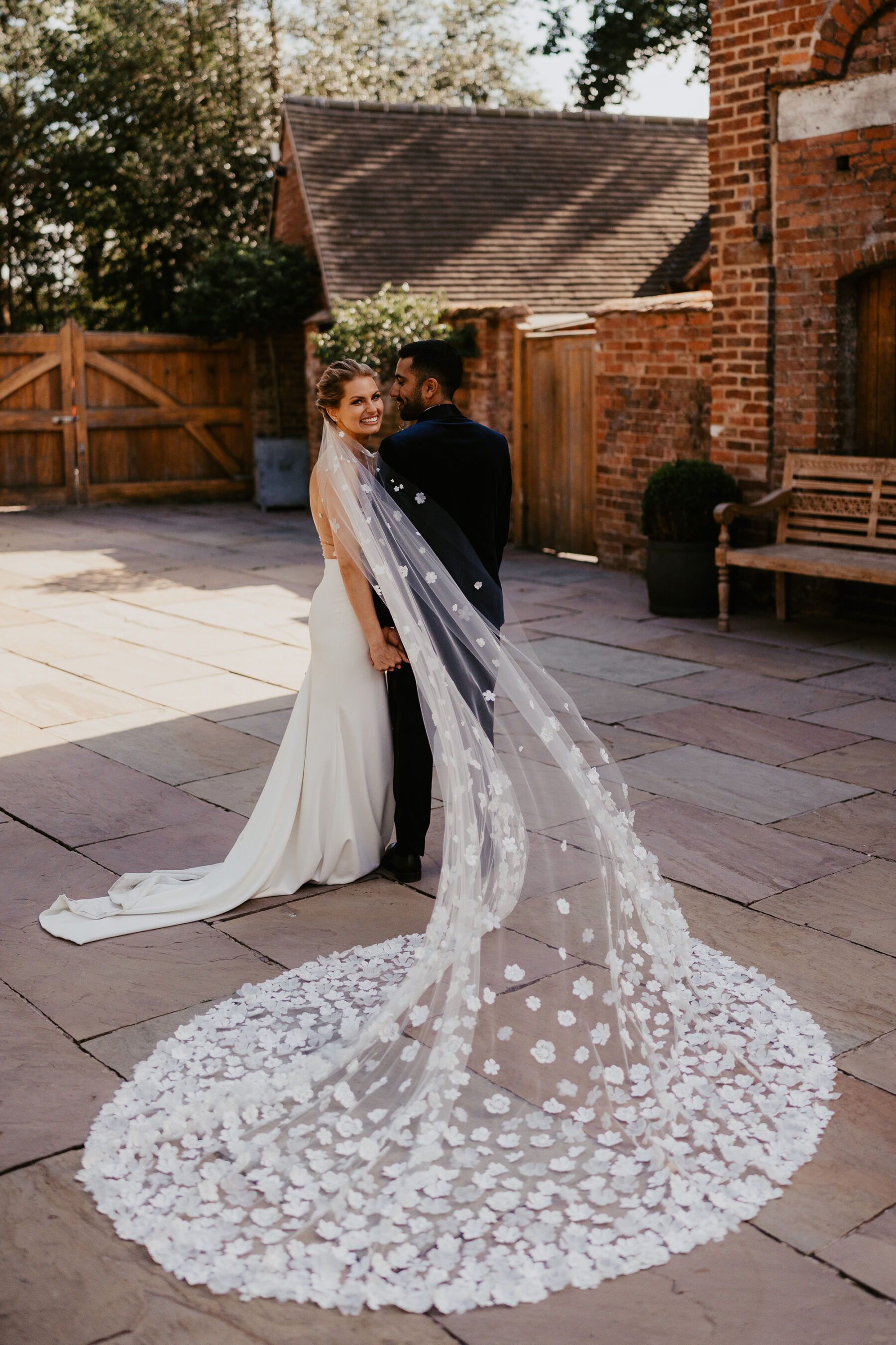 Long wedding veil covered in silk flowers