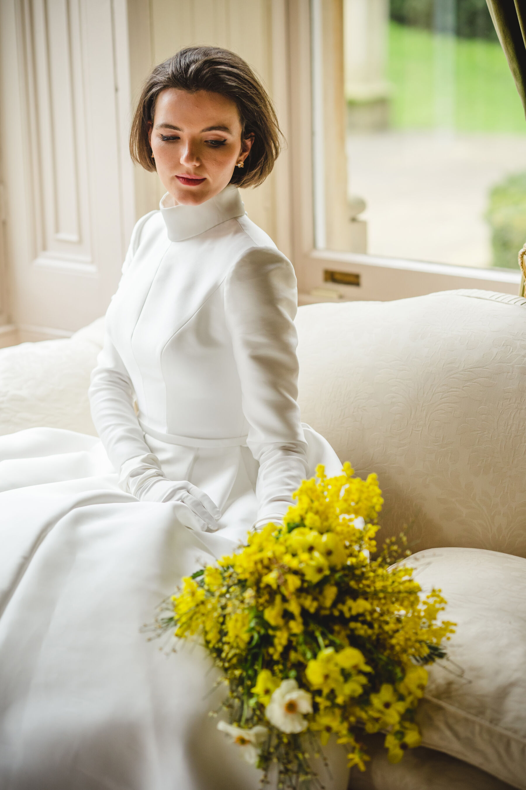 Long sleeved, high collar wedding dress by Jesus Peiro for Miss Bush bridal boutique, Surrey.