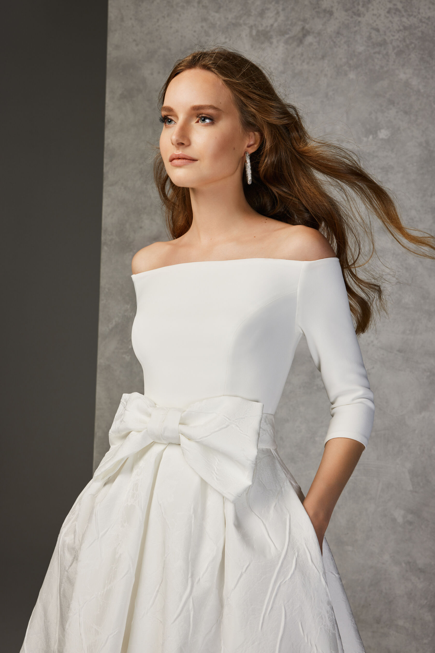 Wedding dress with bow around the waist, available at the Miss Bush pop up sample sale, April 2023.