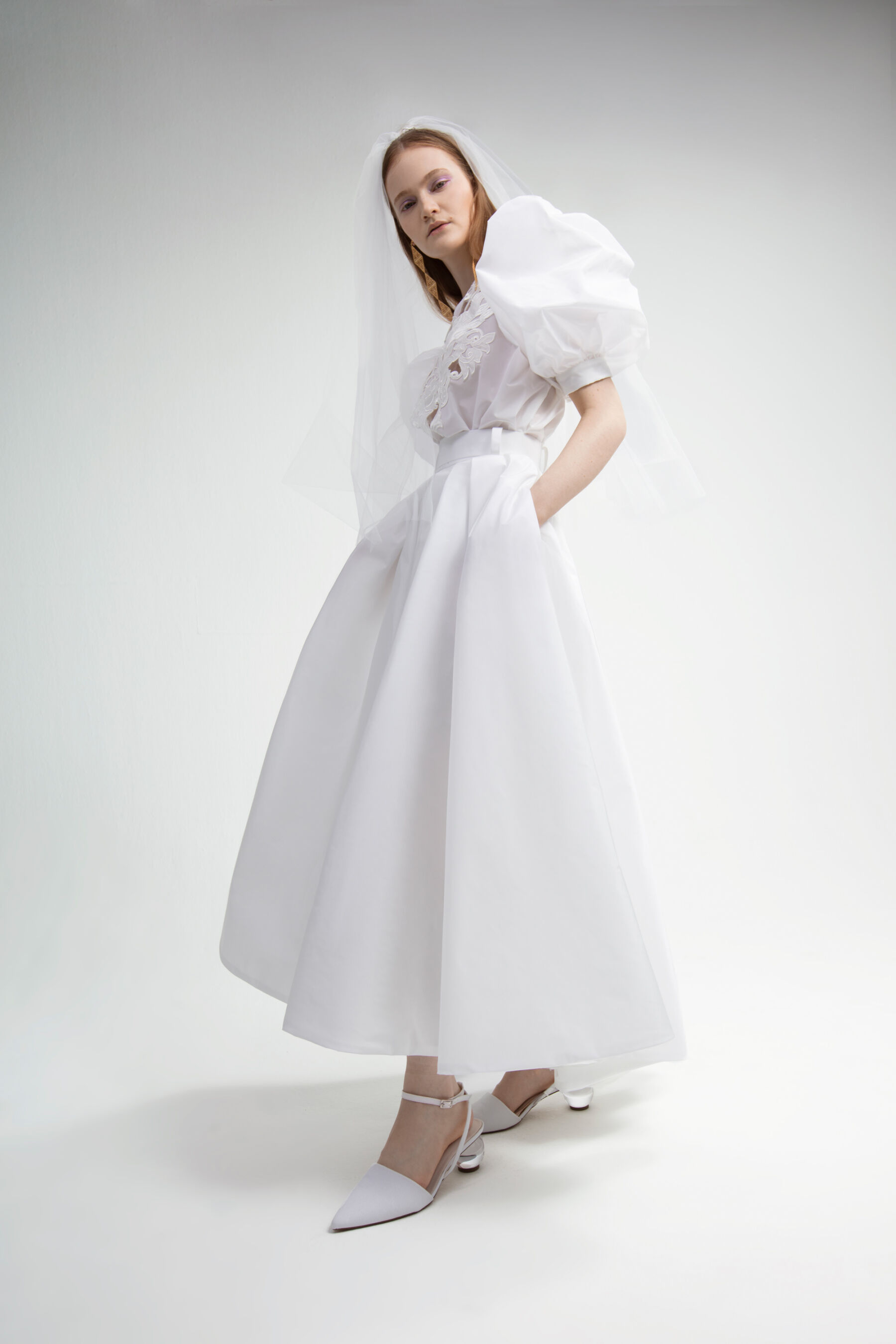 Yolan Cris modern cut-out wedding dress. Available at the Miss Bush pop up sample sale, April 2023.