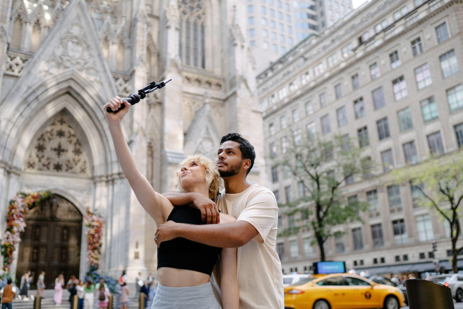 Patchwork alternative wedding gift registry, young mixed race couple taking a selfie in the city