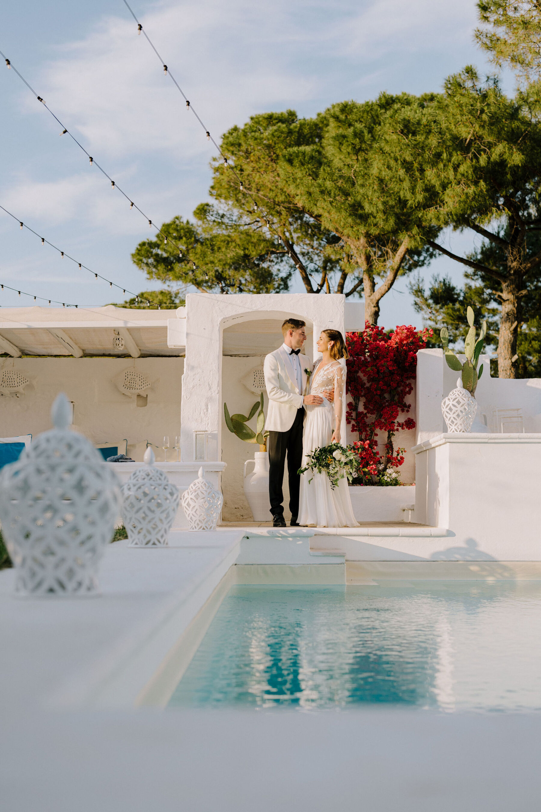 Groom in white tuxedo and bride in Margaux Tardits wedding dress - Italian villa destination wedding.
