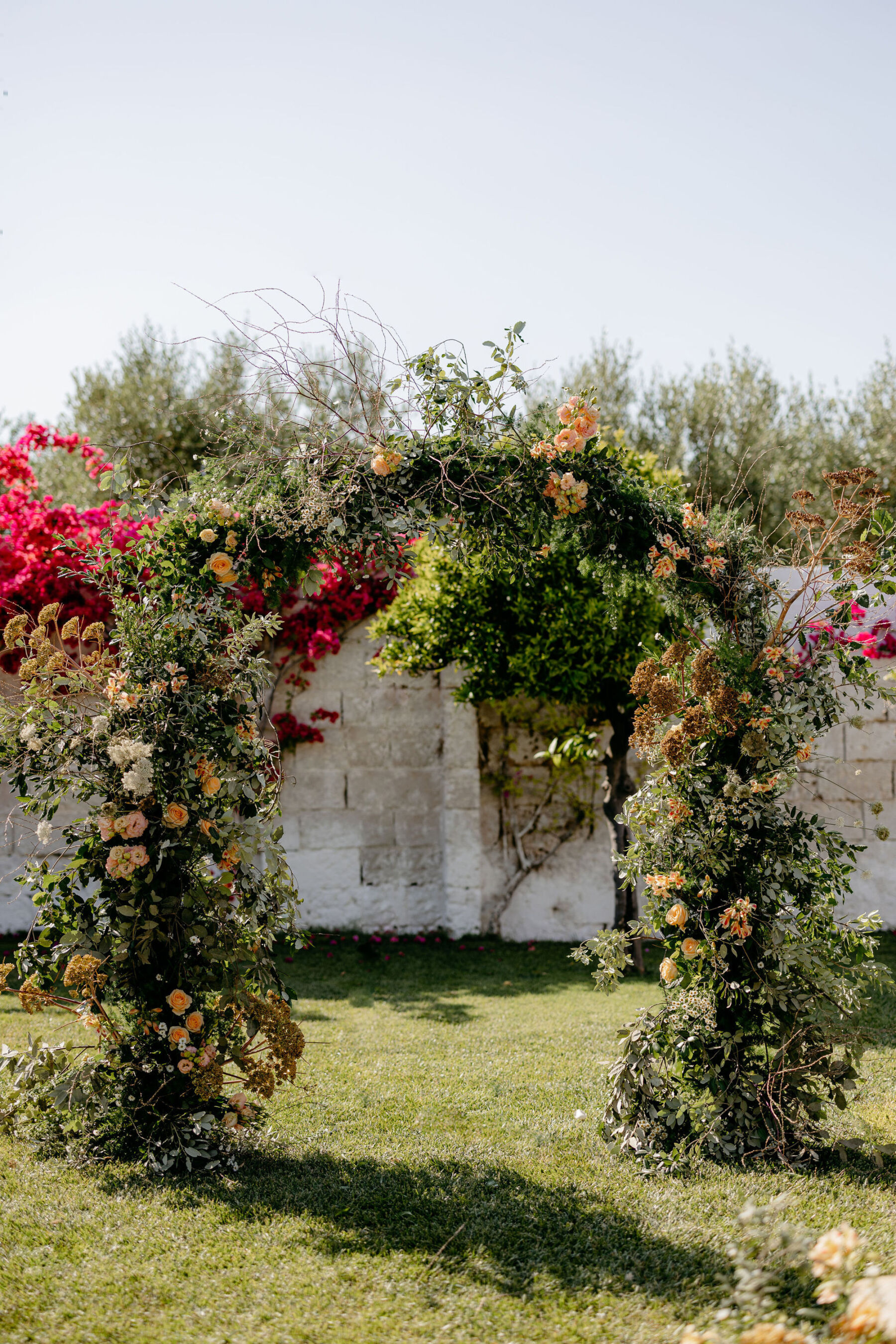 Natural and unruly wedding arch, Puglia, Italy.