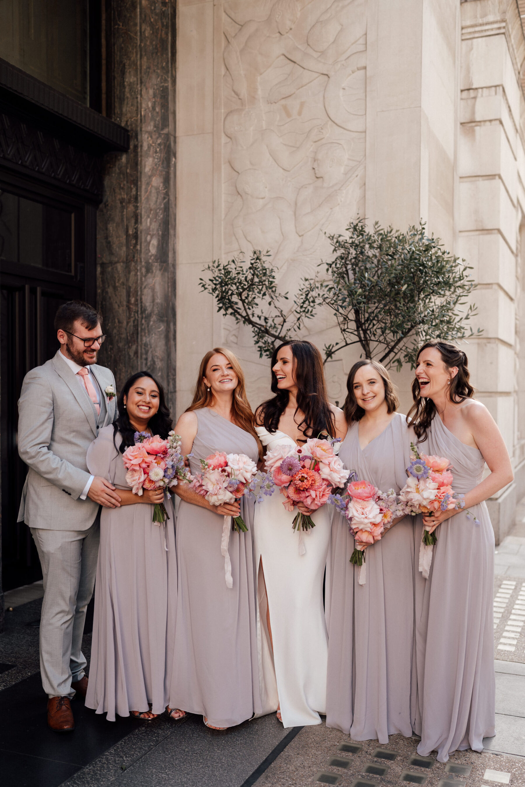 Bridesmaids in dove grey dresses. Bridesman in pale grey M&S suit. The Shannons Photogrpahy.