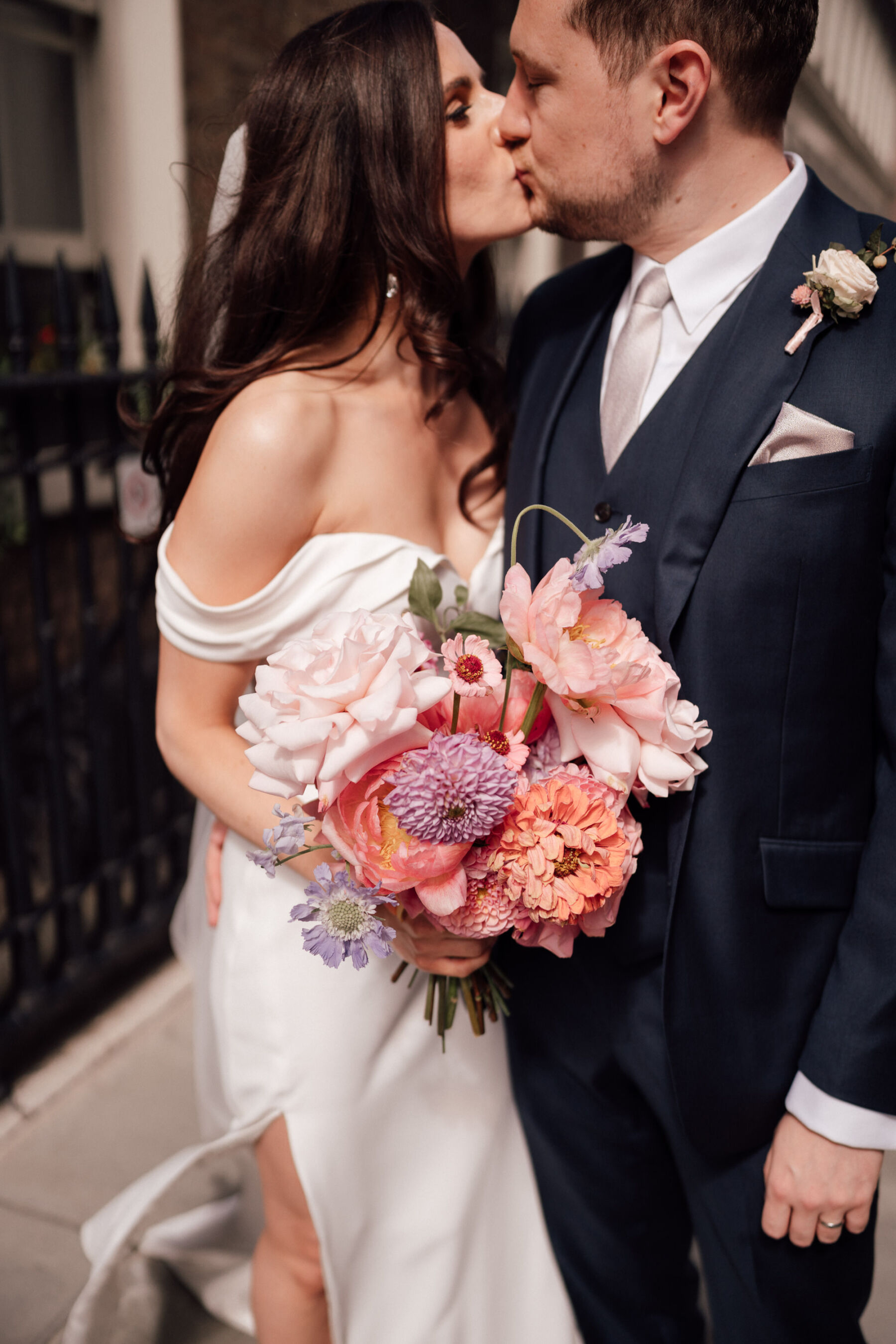 Bride in Roxy by Suzanne Neville, carrying a large, bright and bold bouquet by BUD Flora. The Shannons Phtoography.