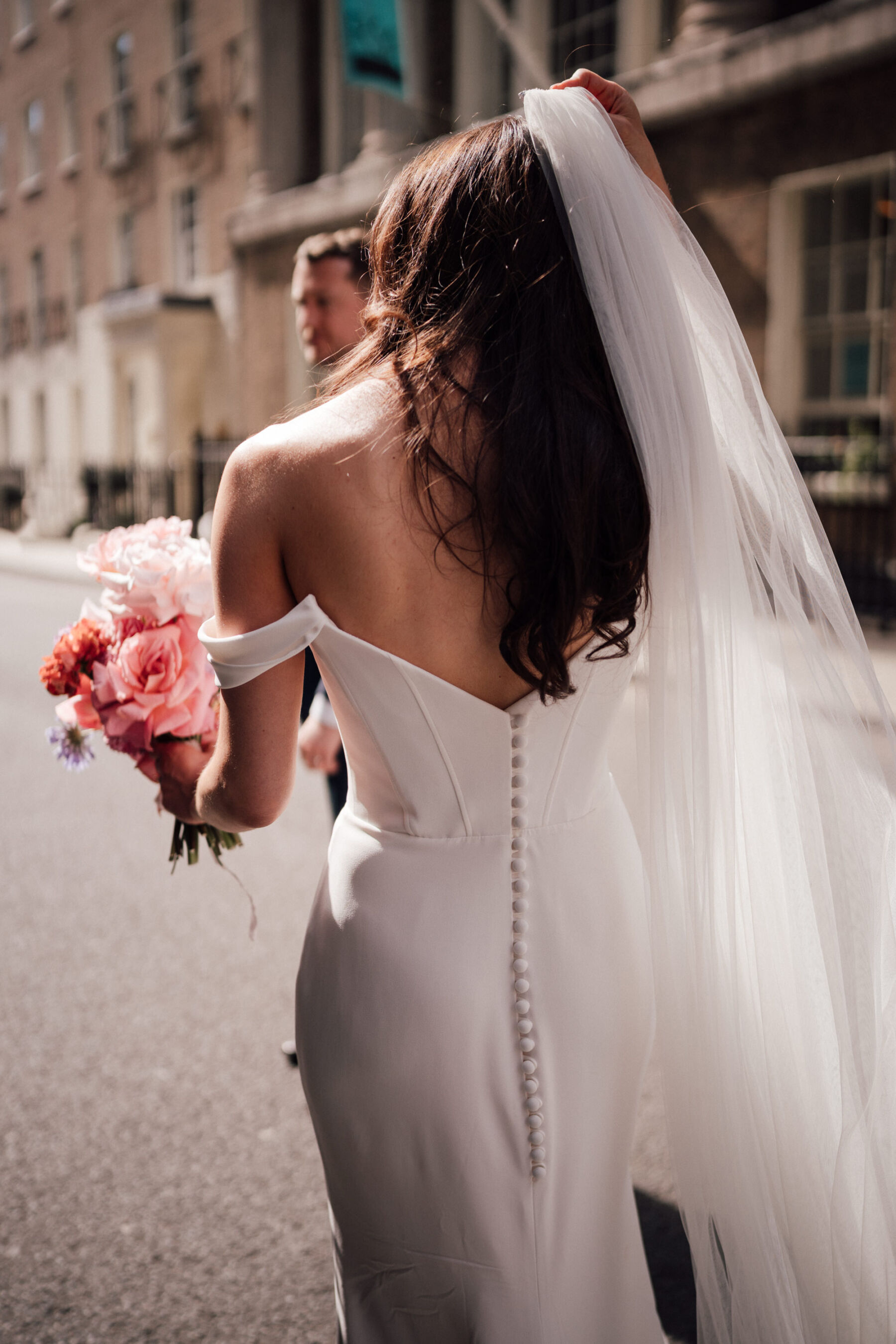 Bride in Roxy by Suzanne Neville, carrying a large, bright and bold bouquet by BUD Flora. The Shannons Phtoography.