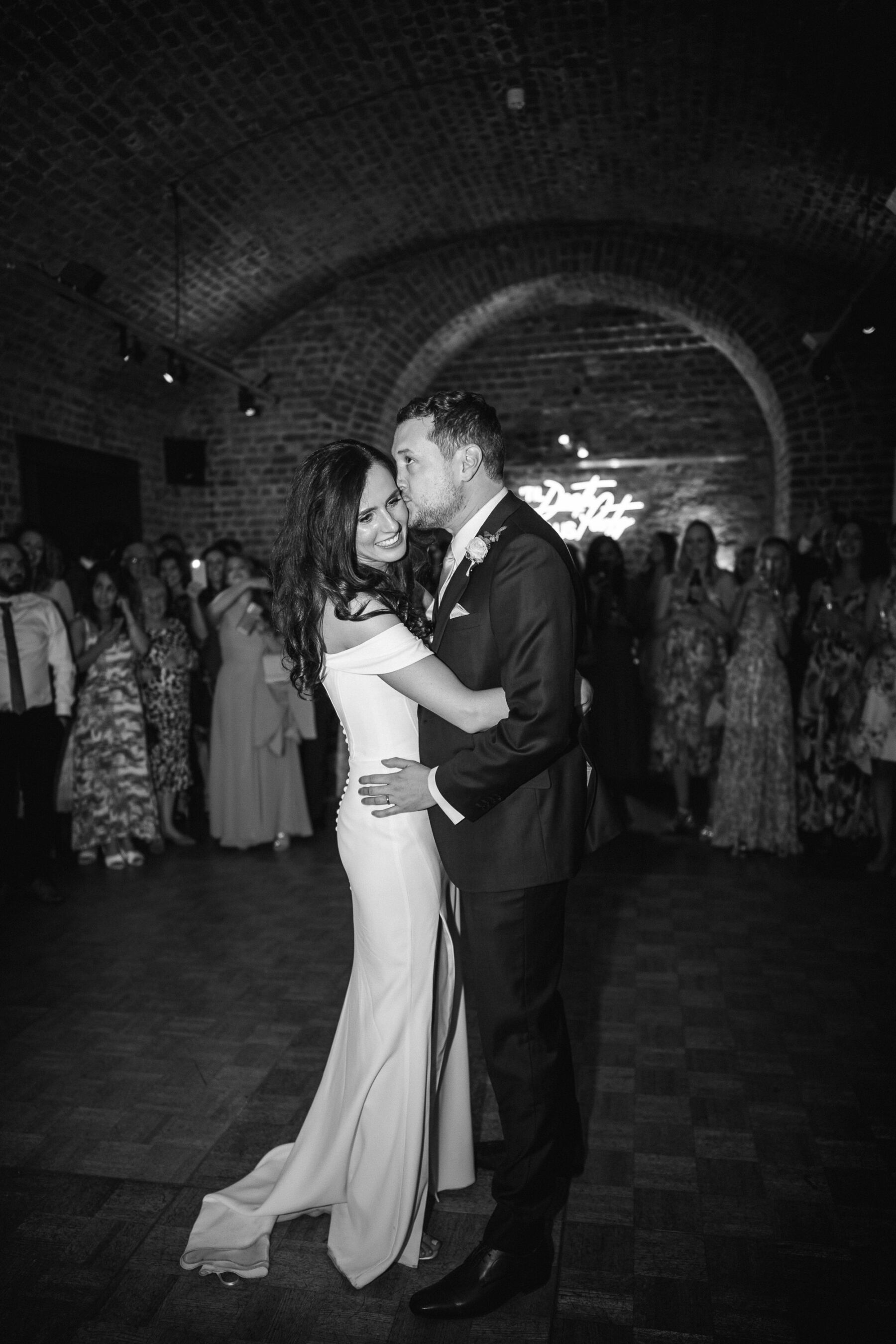 Black and white photography of bride and groom dancing a first dance in The Faults at RSA House. The Shannons Photography.