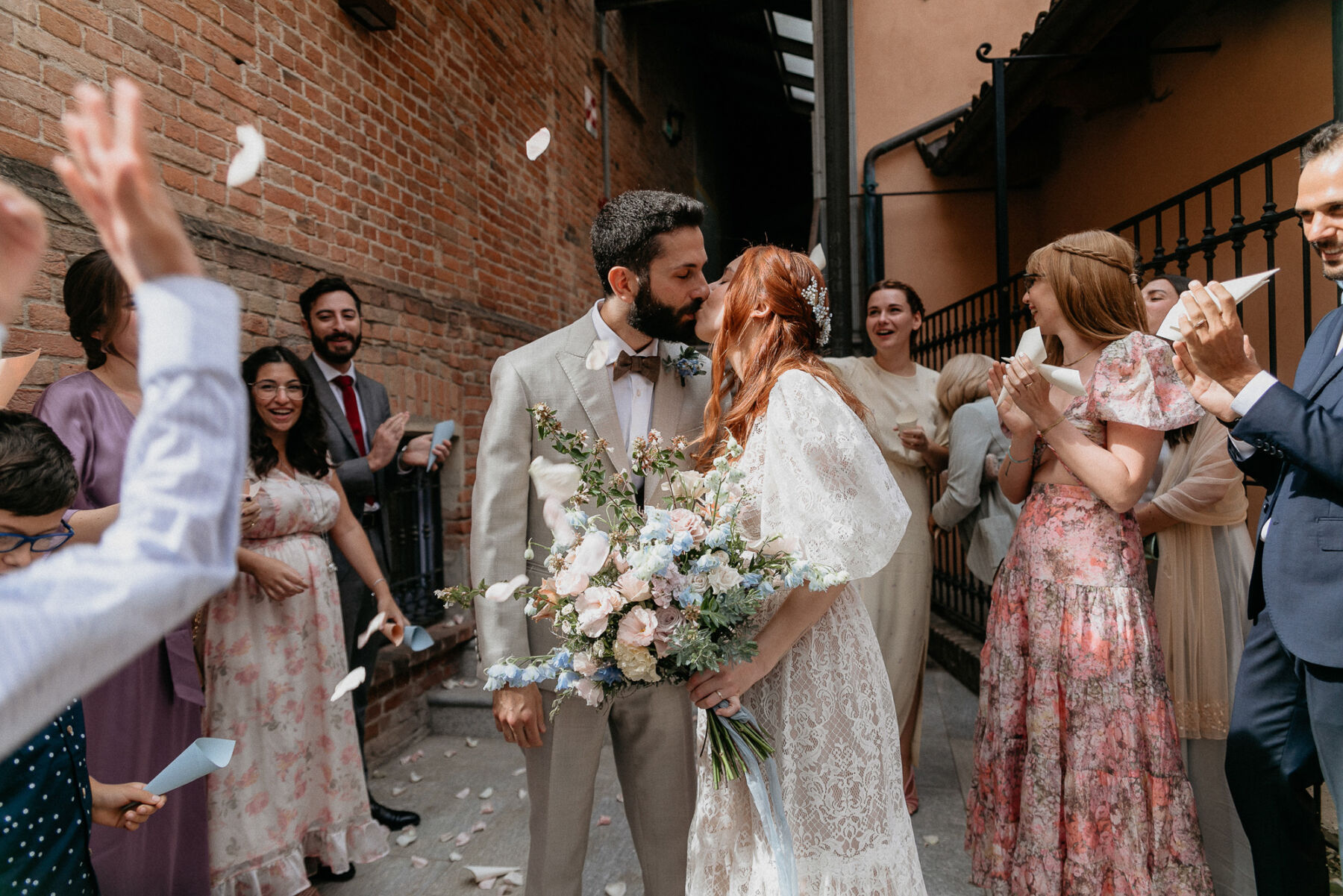 Bride and groom kissing at Italian wedding.
