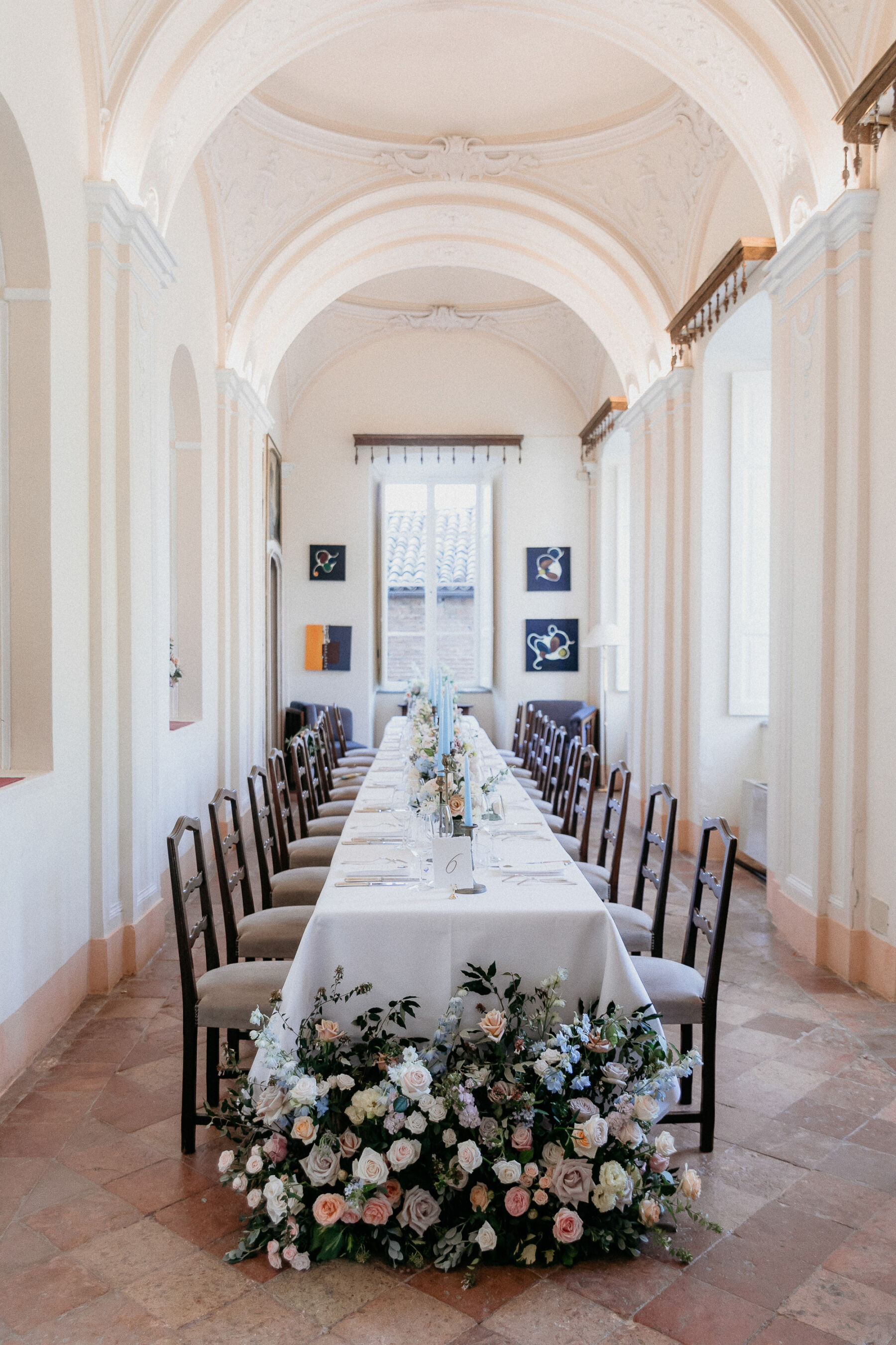 Katya Katya London for an Italian Wedding Inspired by Pre-Raphaelite Art 38 Wedding reception table with end of table meadow flowers.