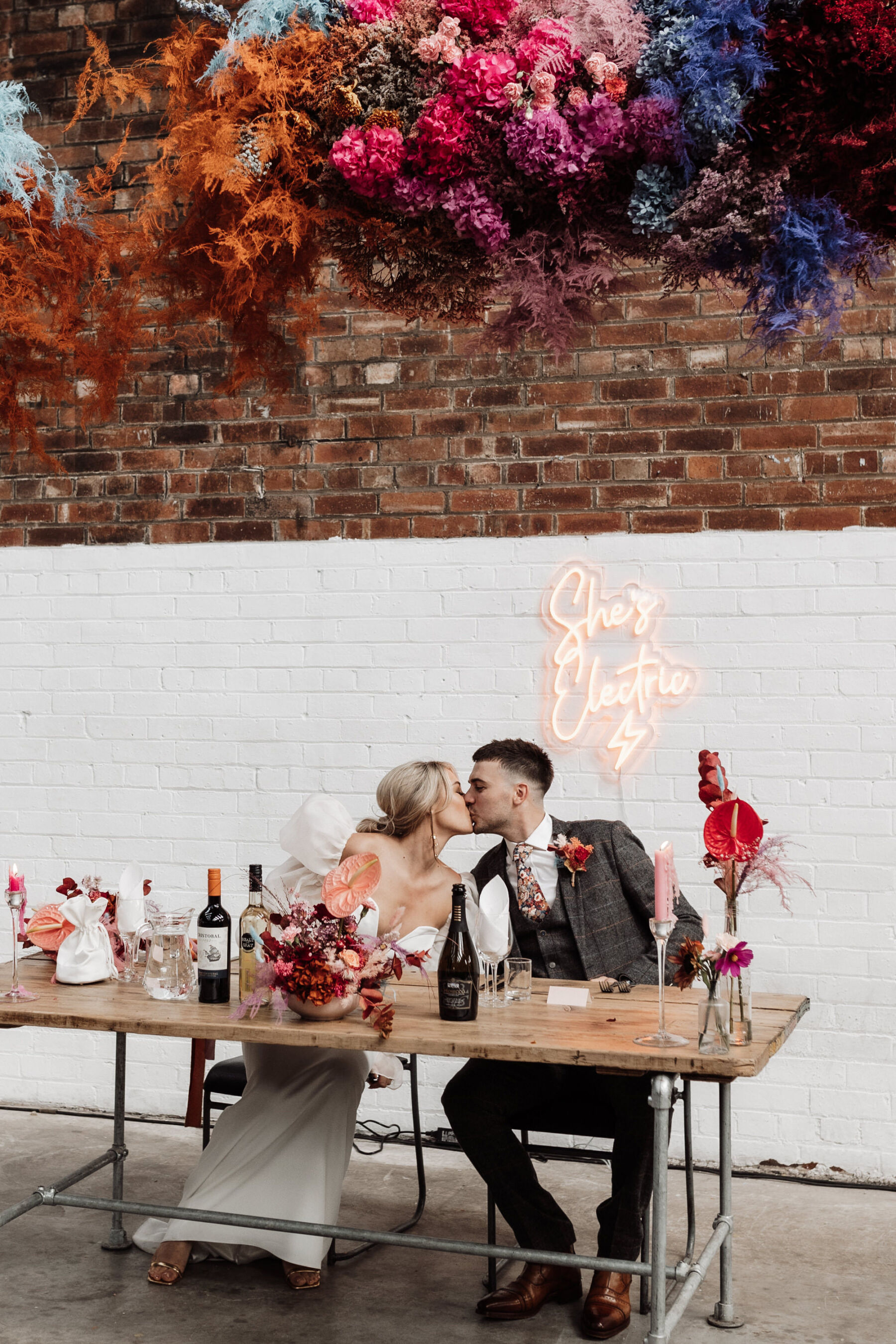 Multi colour modern hanging flowers at Peddler Warehouse wedding in Sheffield. Alexandria French Photography.