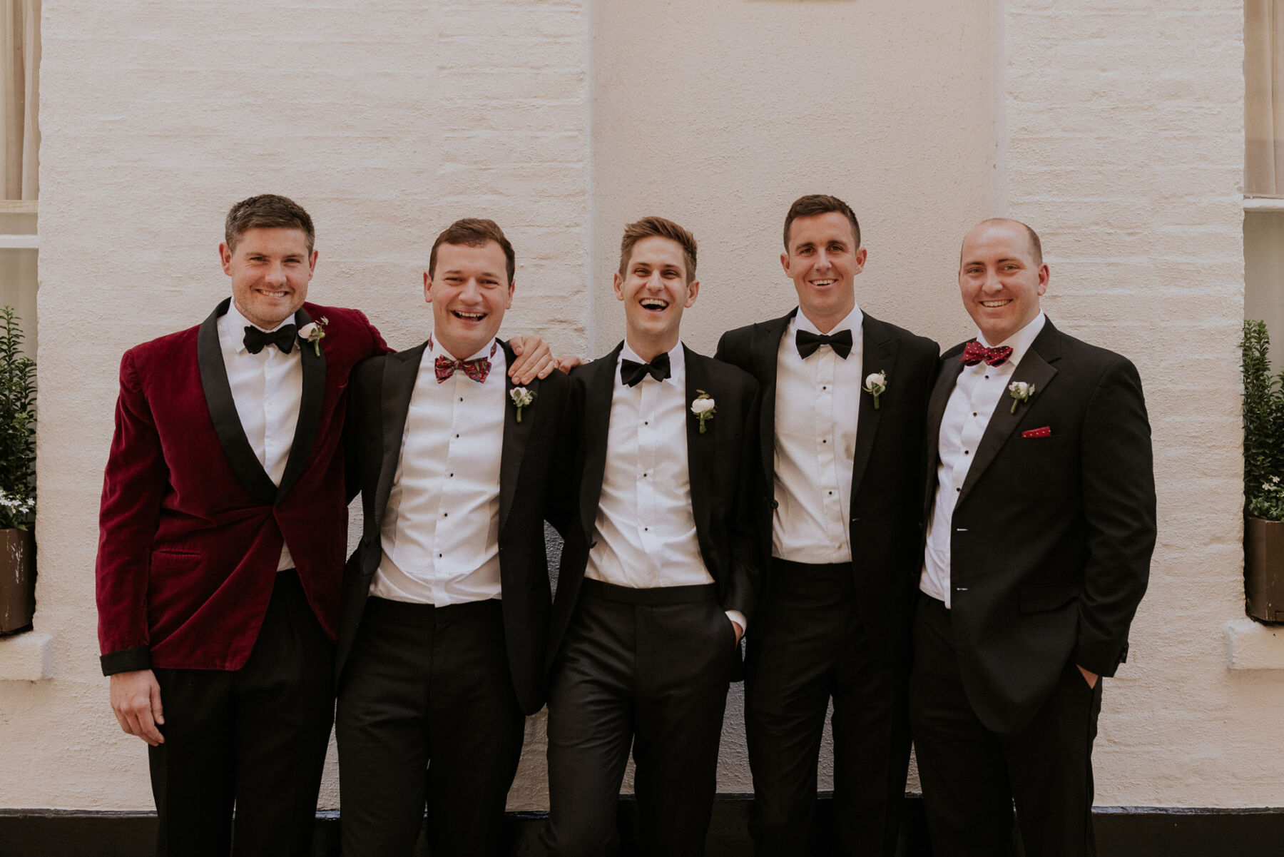 Groom and groomsmen in tuxedo from Moss Bros. Maja Tsolo Photography.