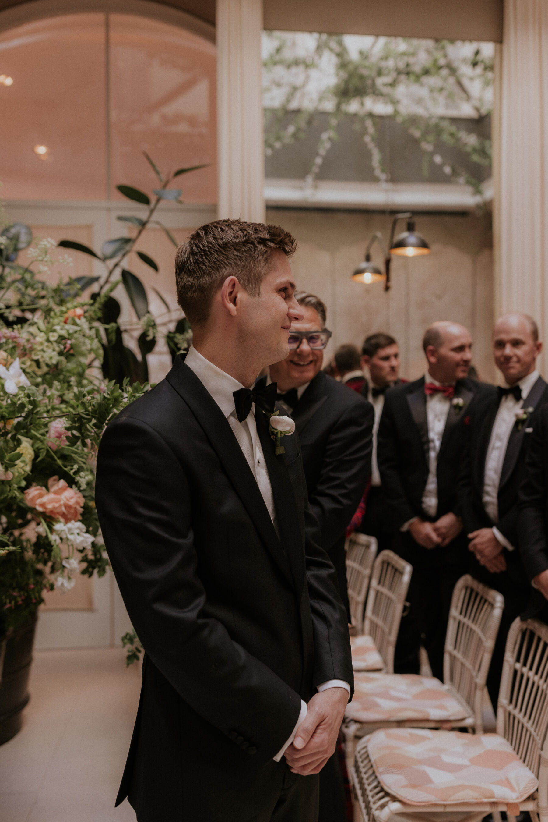 Groom in black tie waiting for his bride. Maja Tsolo Photography.