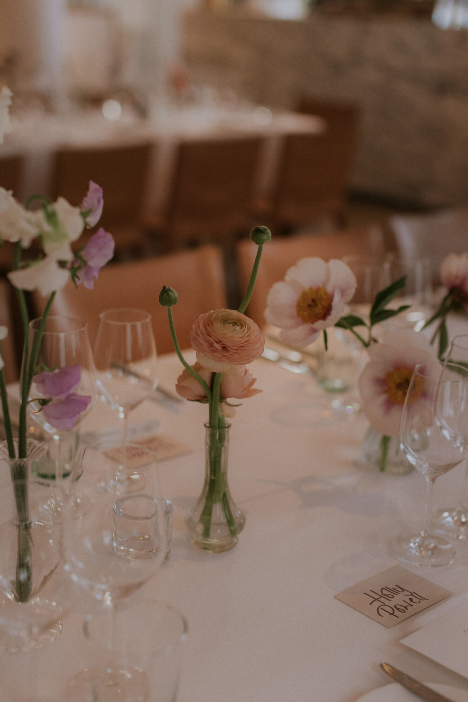 Simple spring wedding flowers in bud vases. Maja Tsolo Photography.
