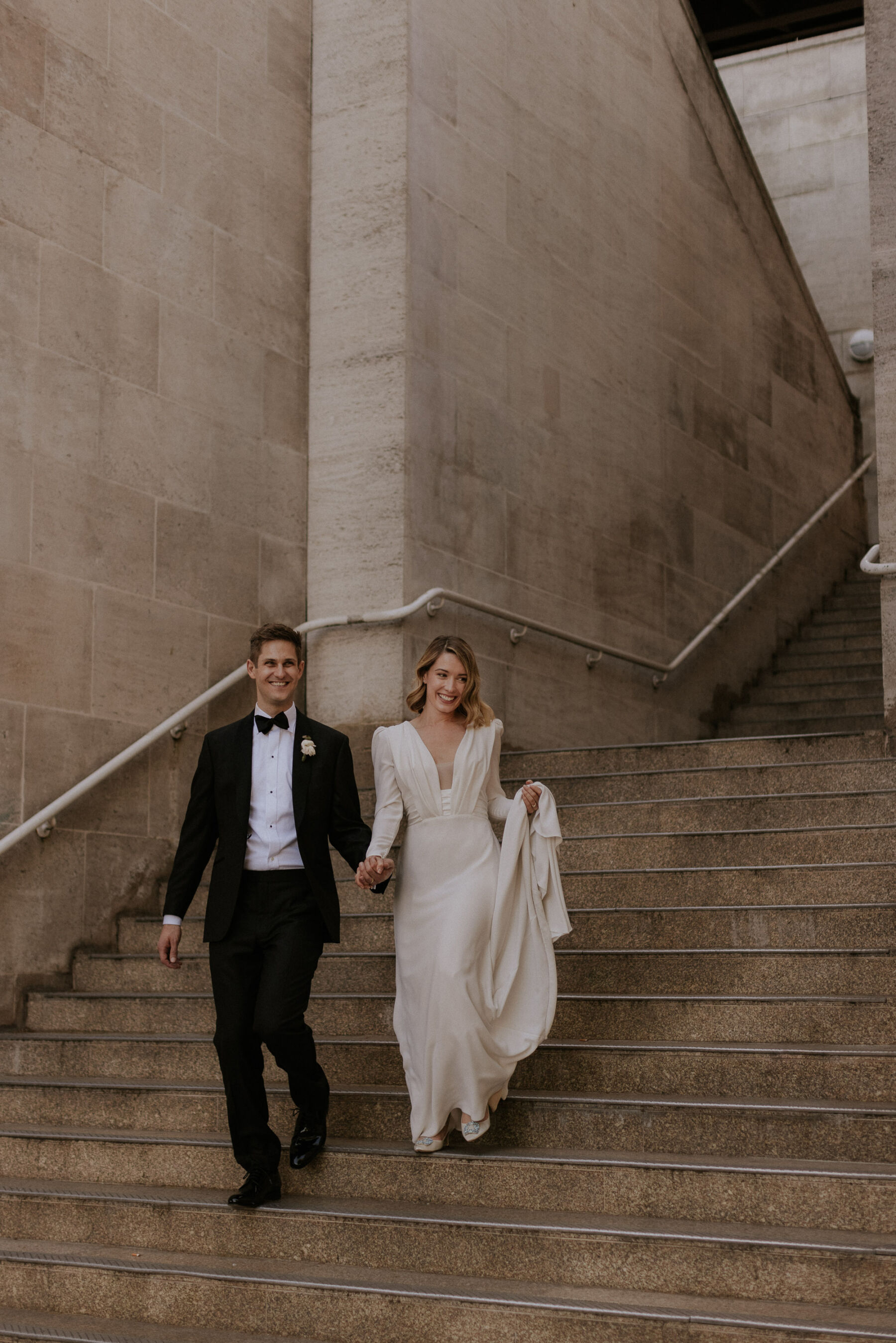 Black tie wedding bride and groom in tuxedo, bride wears Adrienne wedding dress by Pronovias. Maja Tsolo Photography.