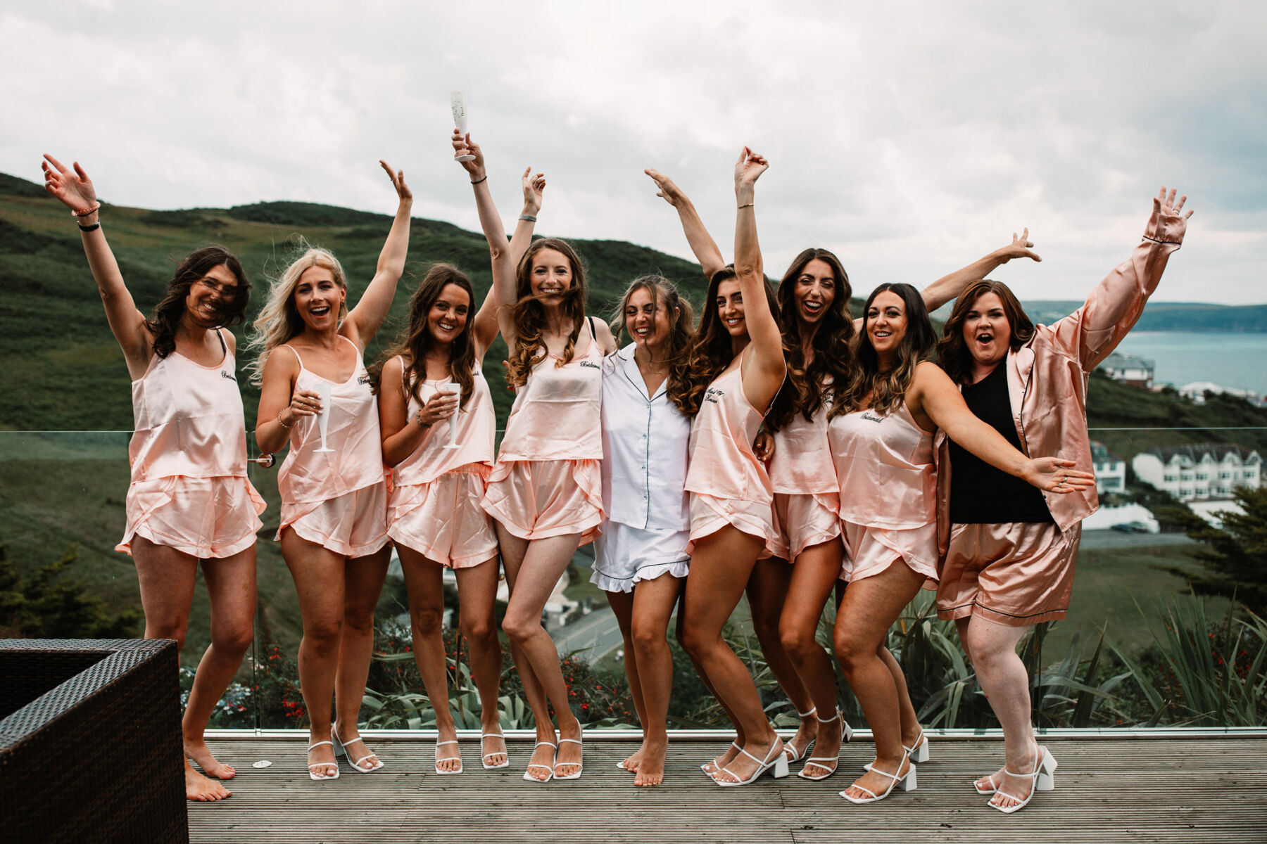 A Devon Wedding with a Sea View for Georgie in Grace Loves Lace 13 Bride getting ready with her bridesmaids in pyjamas