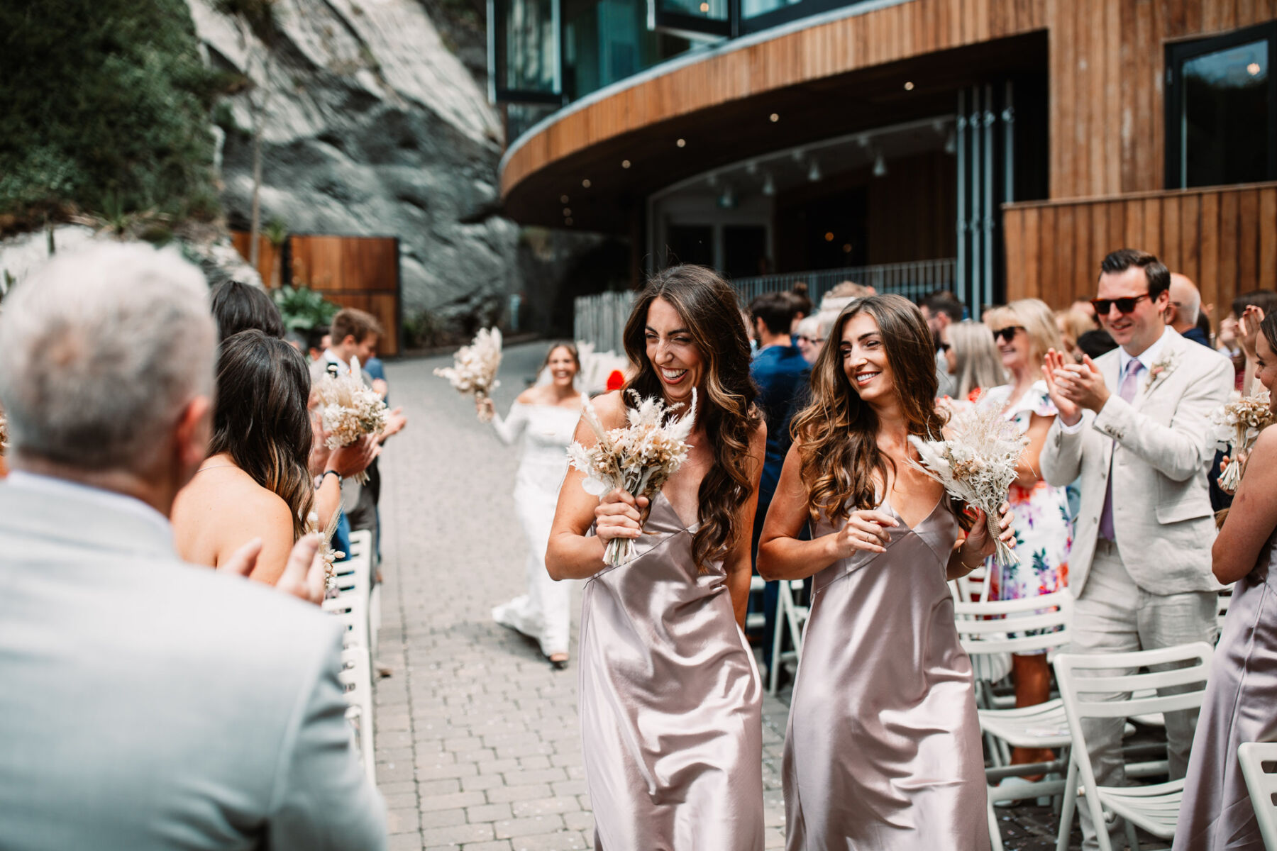 Bridesmaids in Grace Loves Lace dresses at Tunnels Beaches wedding venue, Devon