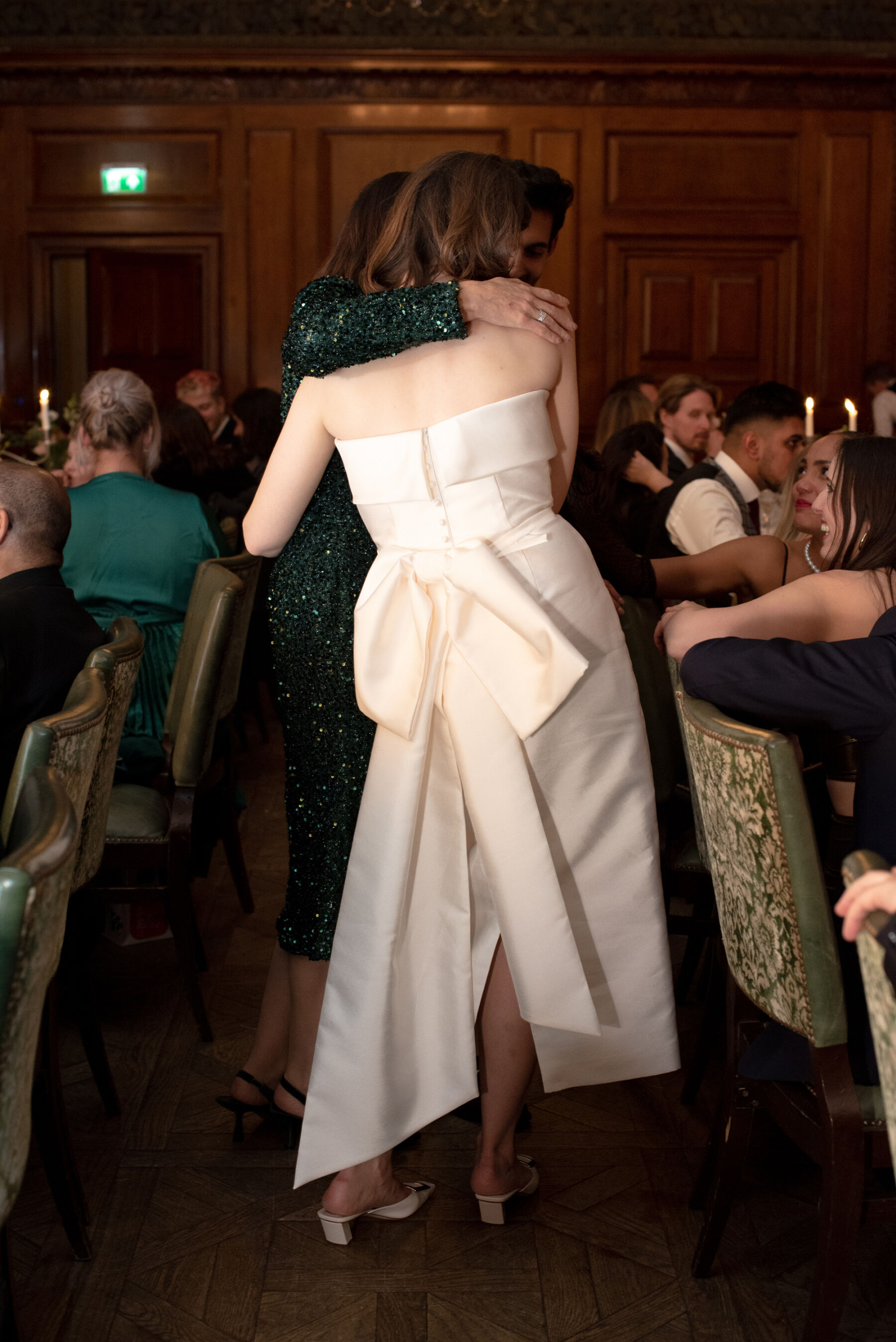 Bride hugging her guests at the reception