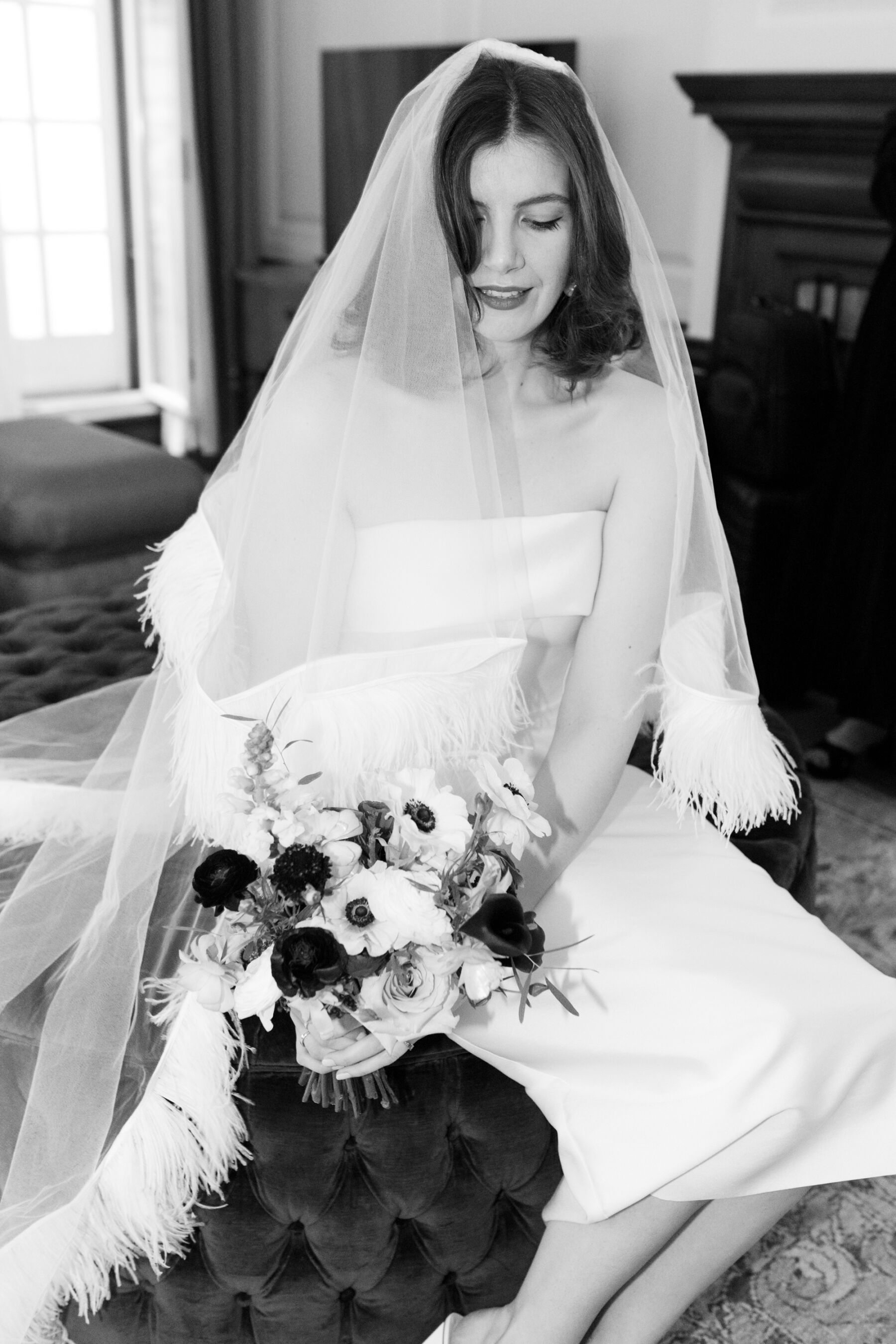 Bride wearing a Christopher Kane feather wedding veil & Jessica Bennett wedding dress.