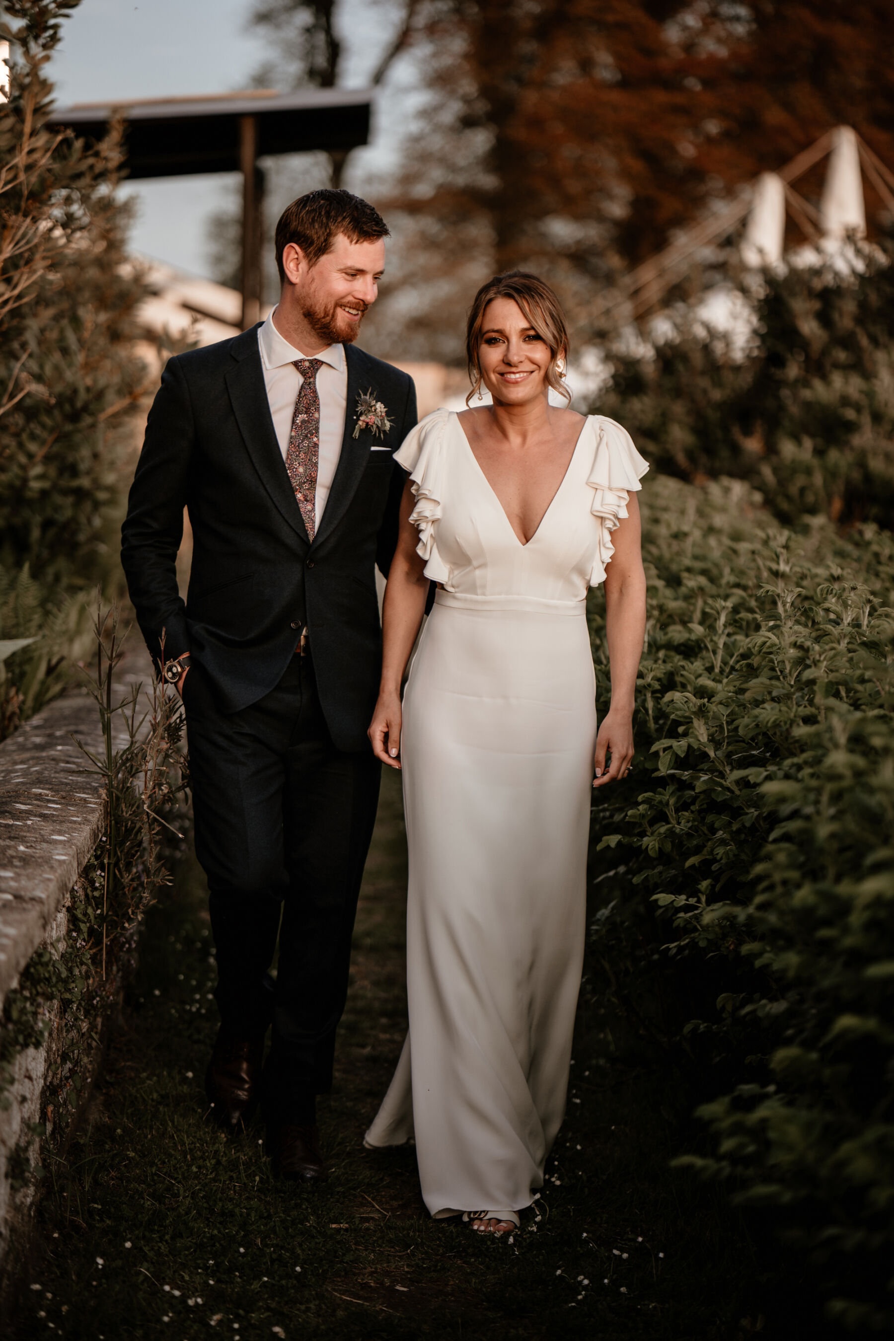 Bride with an Alexander Grecco wedding dress with ruffled sleeves
