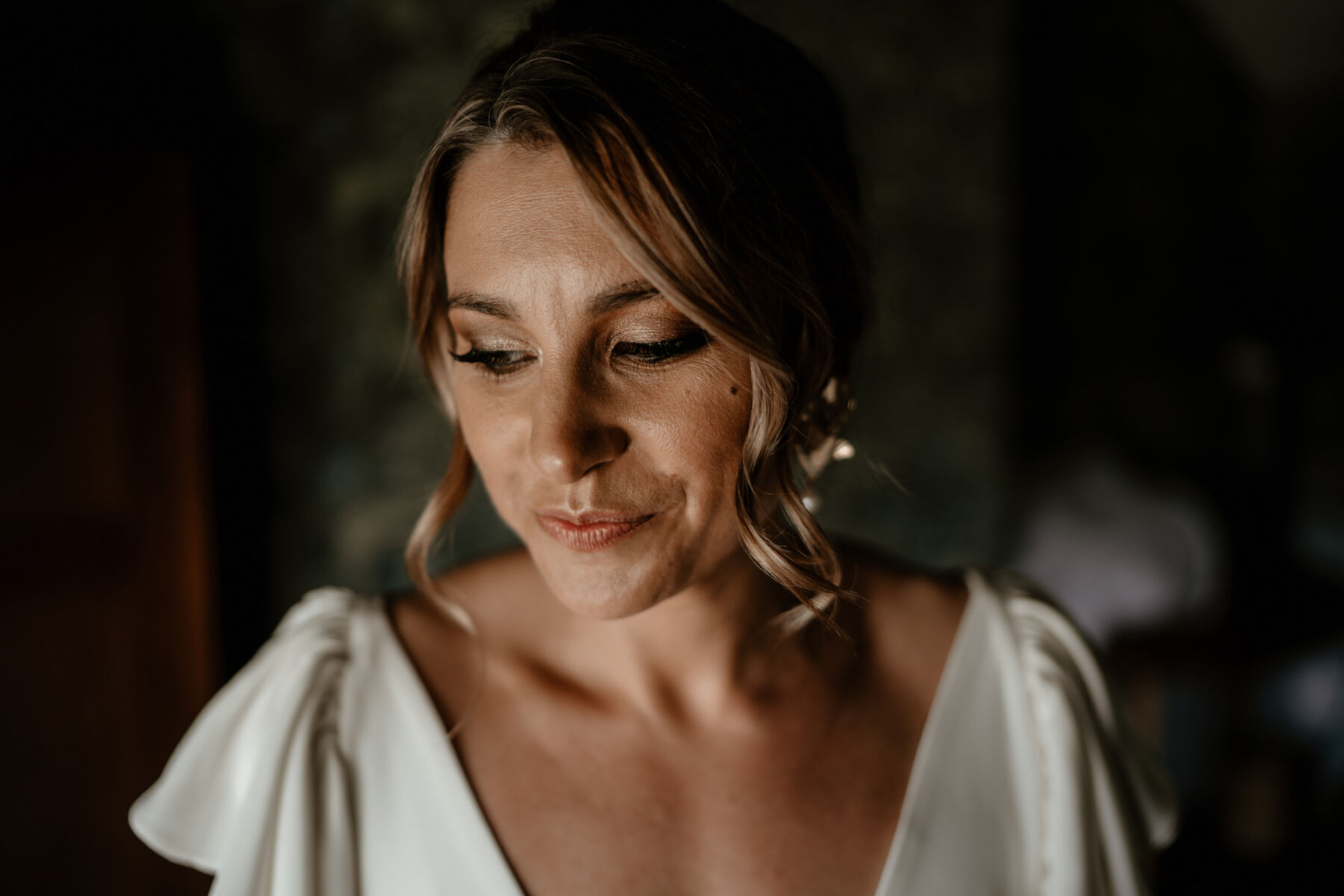 Beautiful bridal hair and makeup, soft tousled hair and pale lip.