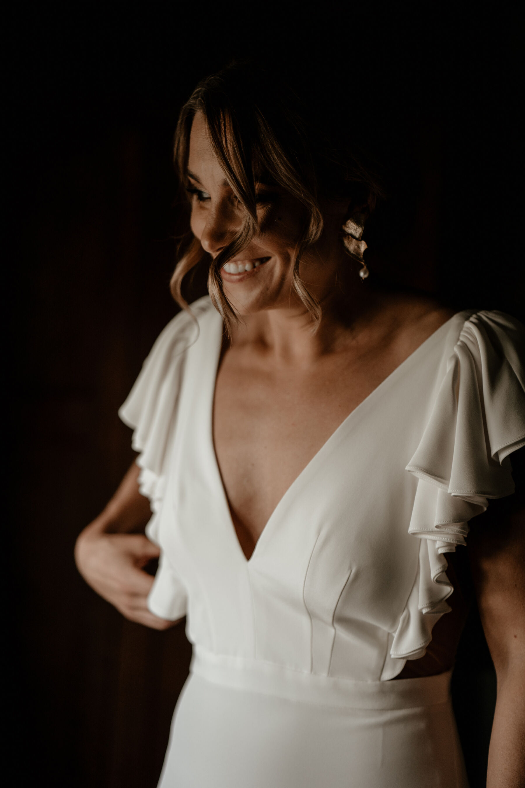 An Alexandra Grecco Dress With Ruffled Sleeves for Lizi and James' Foodies Wedding in Wiltshire 12 Bride in Alexander Grecco wedding dress and modern gold earrings