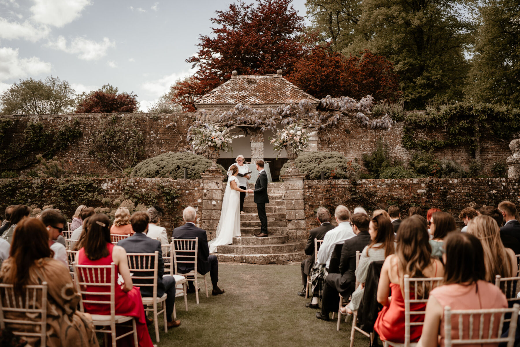 Bride and groom marrying outdoors in Wiltshire